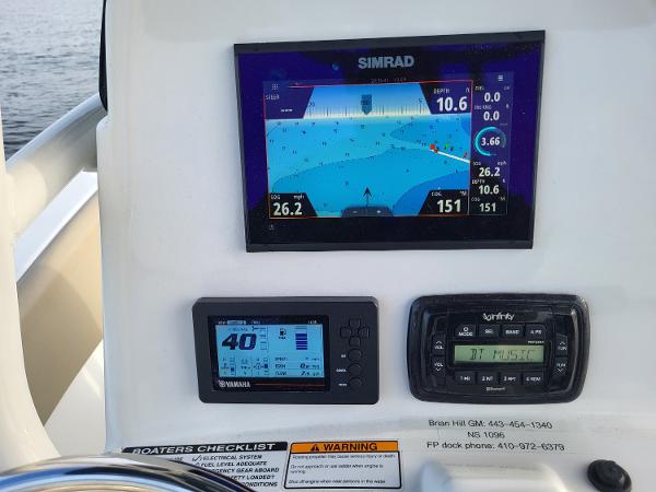 Control panel of a 2021 NauticStar 2302 Legacy boat with Simrad display.