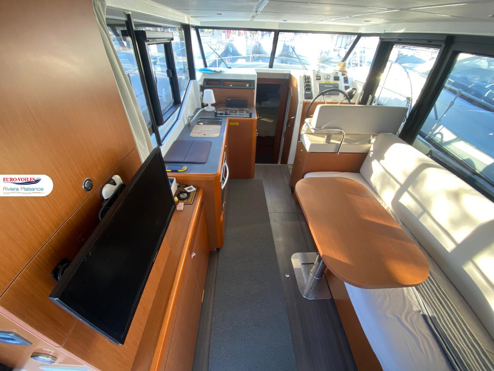 Interior of 2016 Beneteau Swift Trawler 30, featuring modern design and comfortable seating.