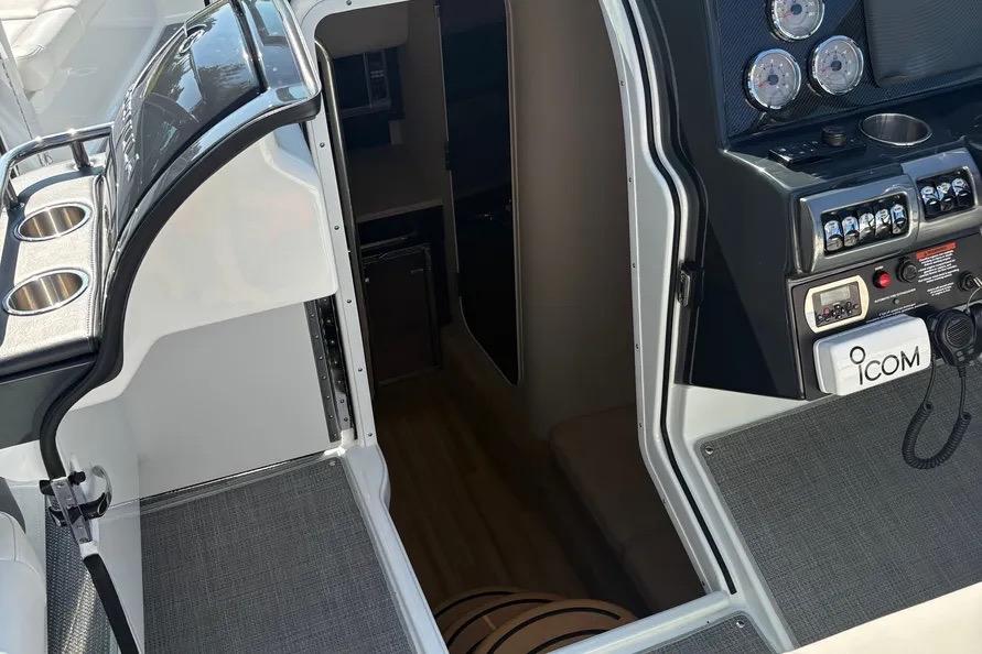 2015 Formula 350 Crossover Bowrider interior with control panel and cabin entrance.
