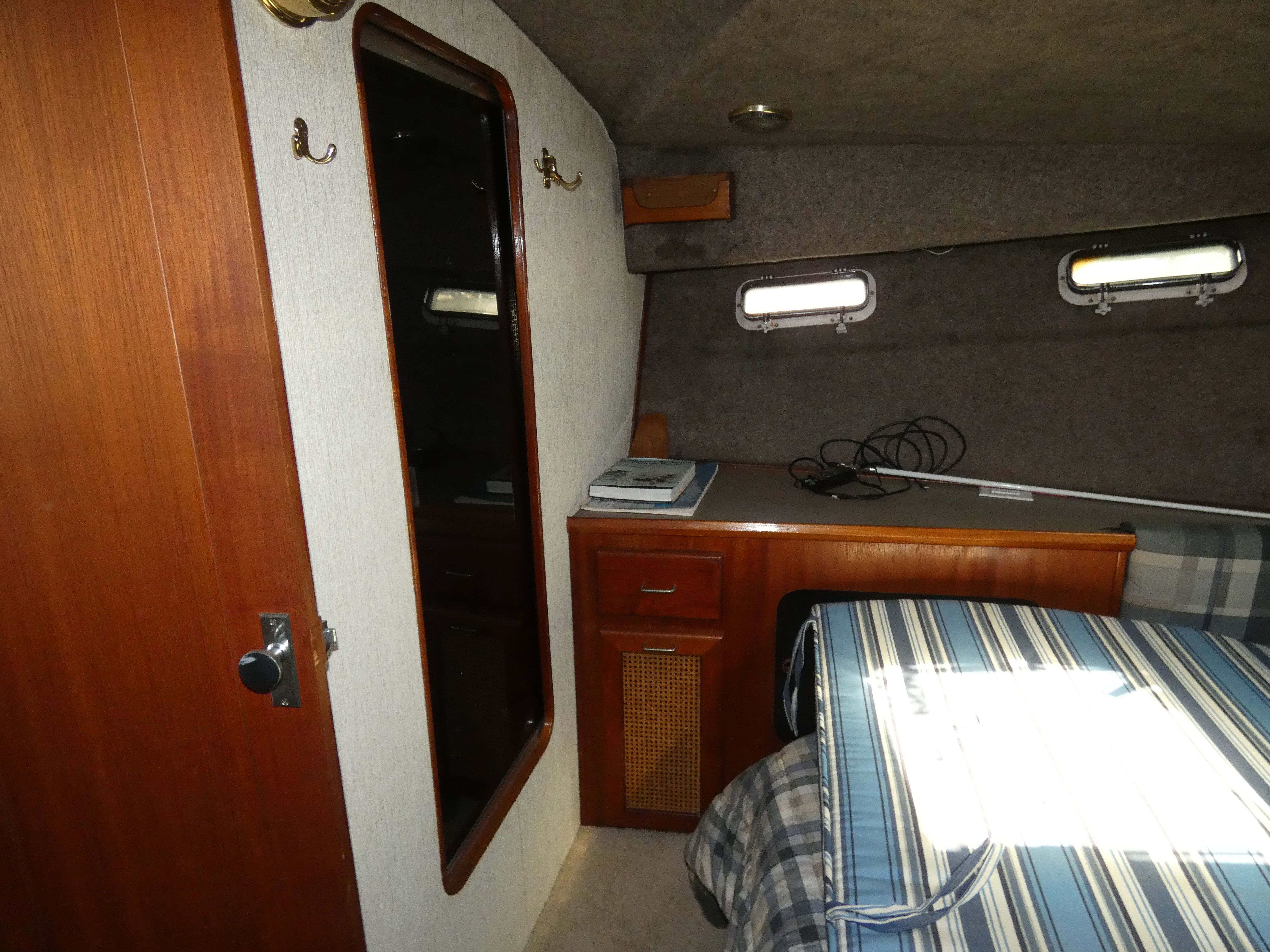 1984 Bayliner 3870 Motoryacht interior with desk and bed.