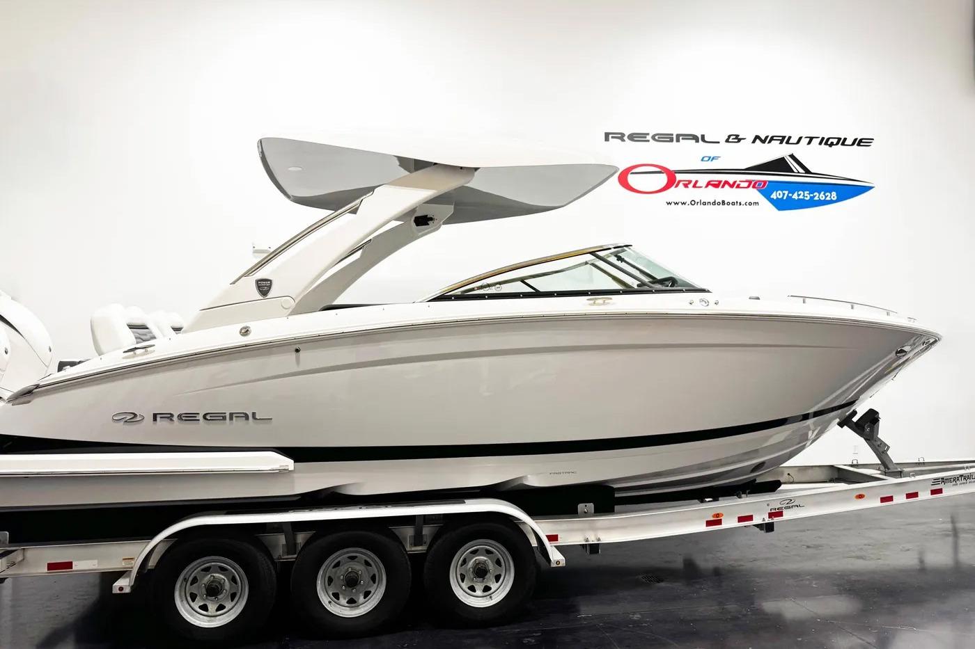 2026 Regal LX9 boat on trailer, displayed indoors at Regal & Nautique of Orlando.