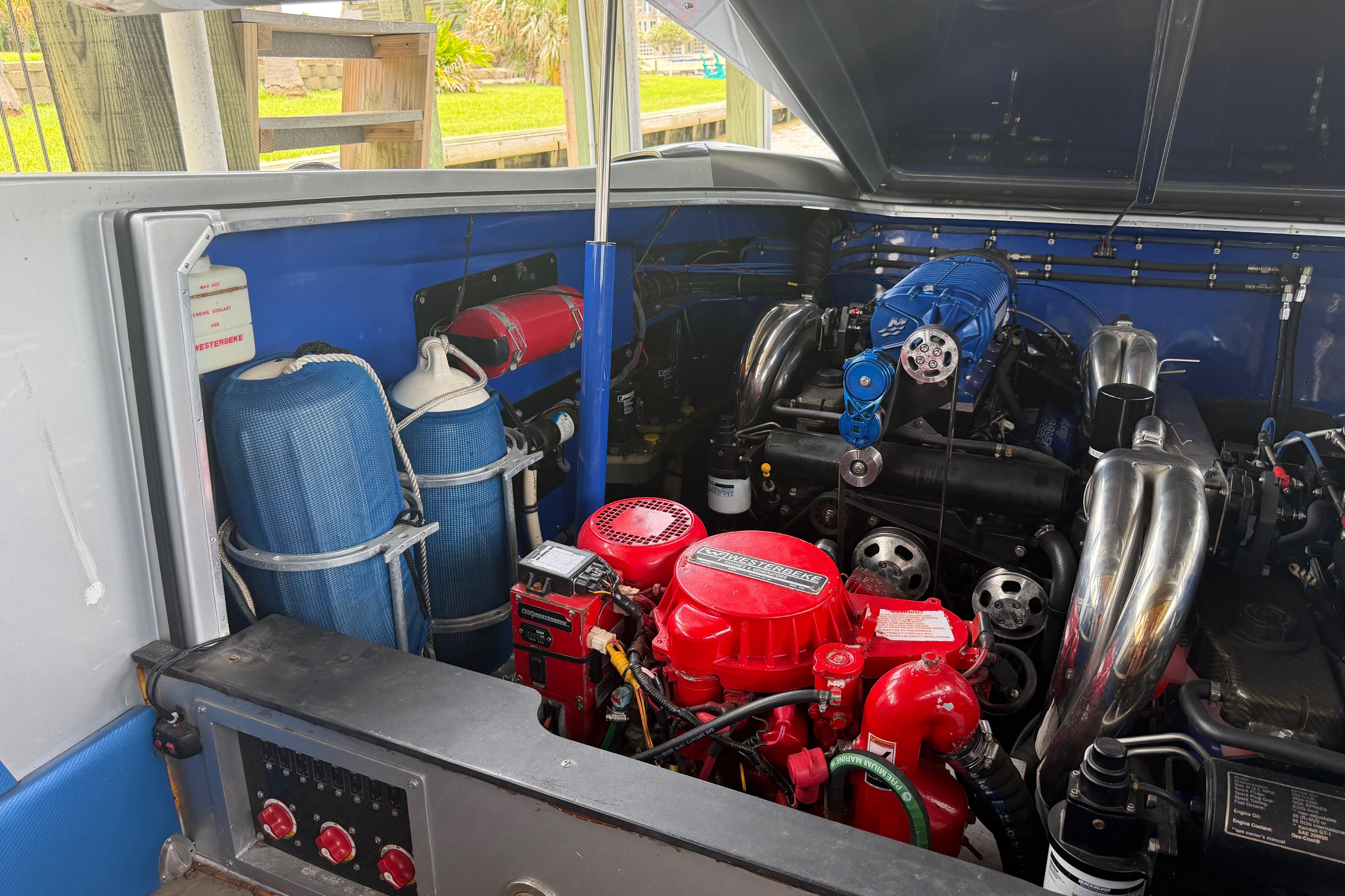 Engine compartment of a 2013 Nor-Tech 477 SPX Vee Bottom boat, showcasing detailed components.