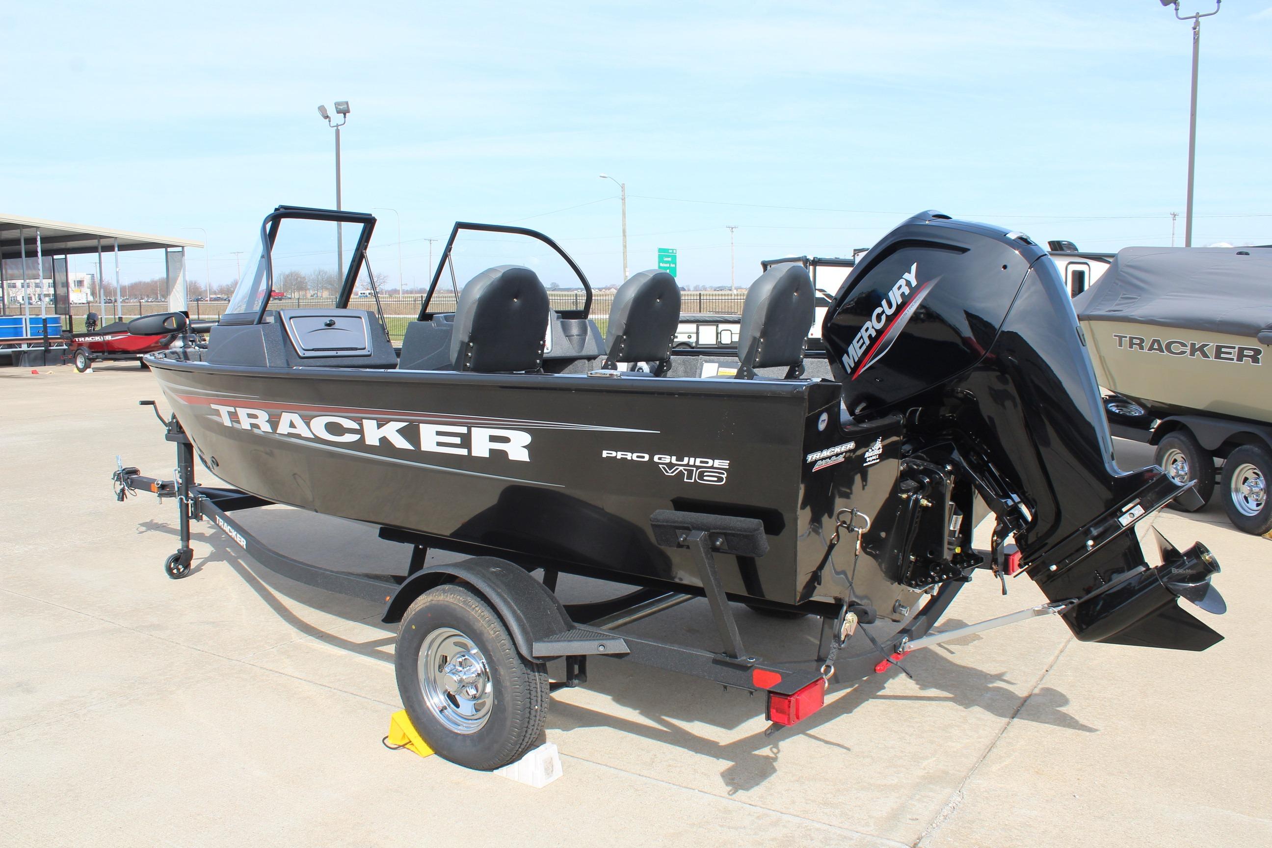 2026 Tracker Targa V-18 Combo boat with Mercury engine on trailer, parked outdoors.