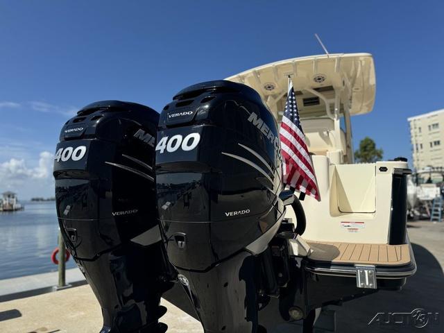 2022 Scout 330 LXF boat with twin Mercury 400 Verado engines at dock.