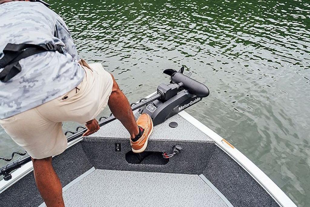 Man on 2026 Lowe Fishing Machine 175 boat with MotorGuide trolling motor.