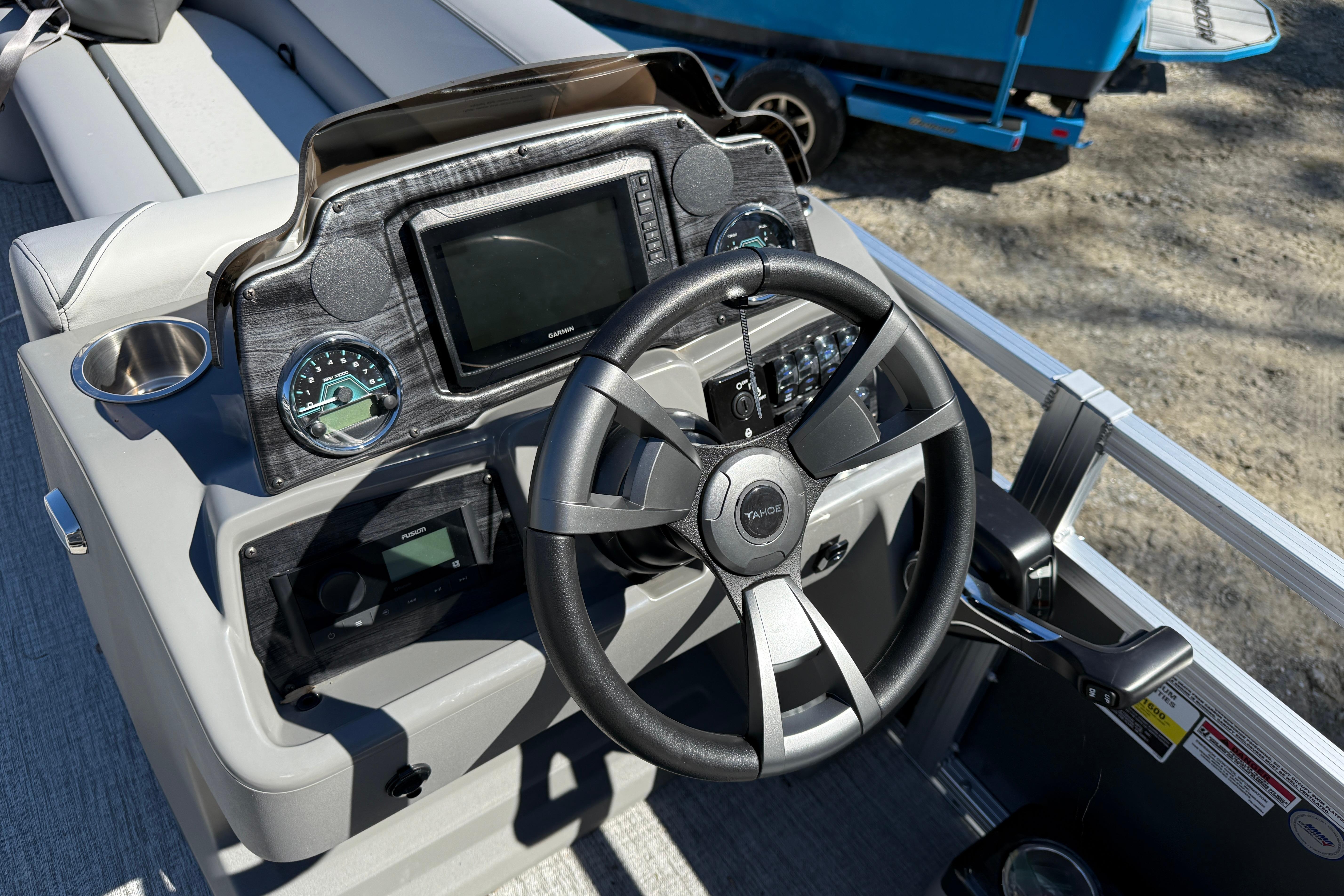 2026 Tahoe Pontoon Sport 85 Rear Fish dashboard with steering wheel and controls.
