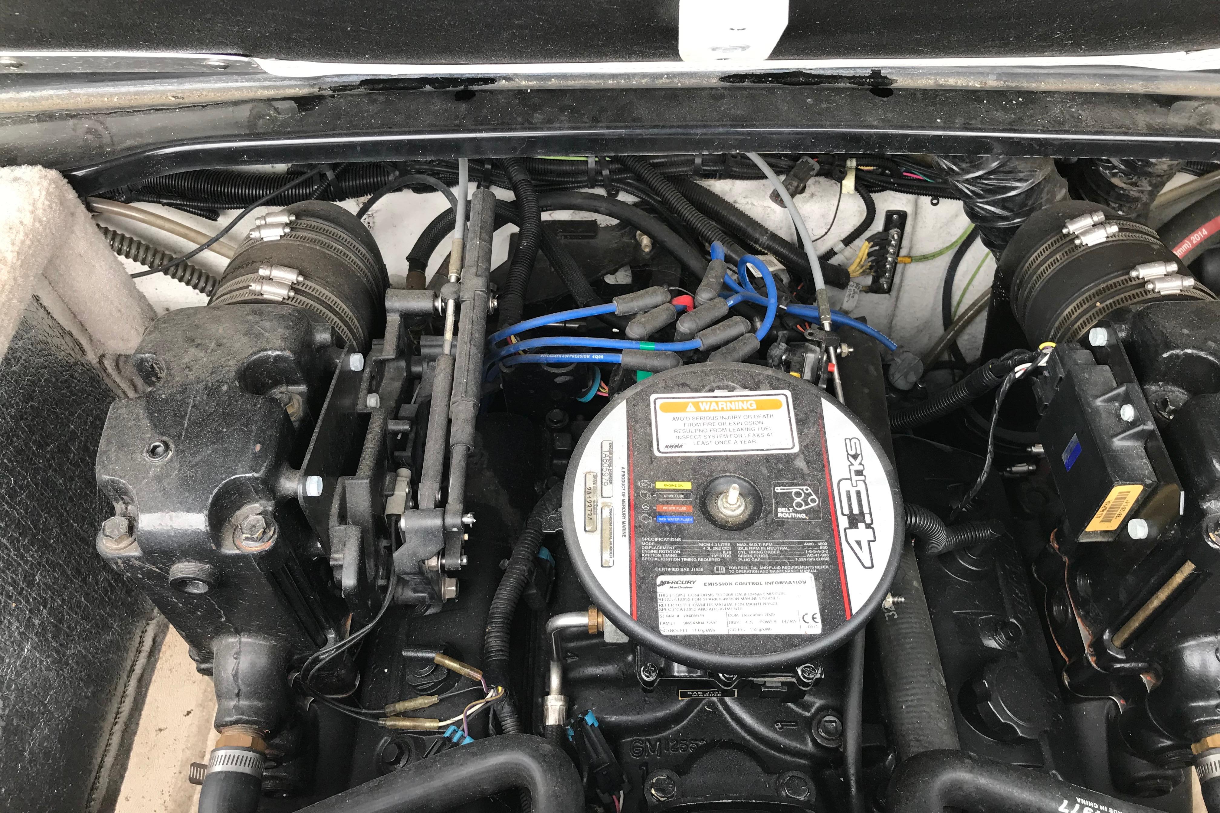 Engine compartment of a 2015 Crownline 18 SS boat, featuring a 4.3L engine.