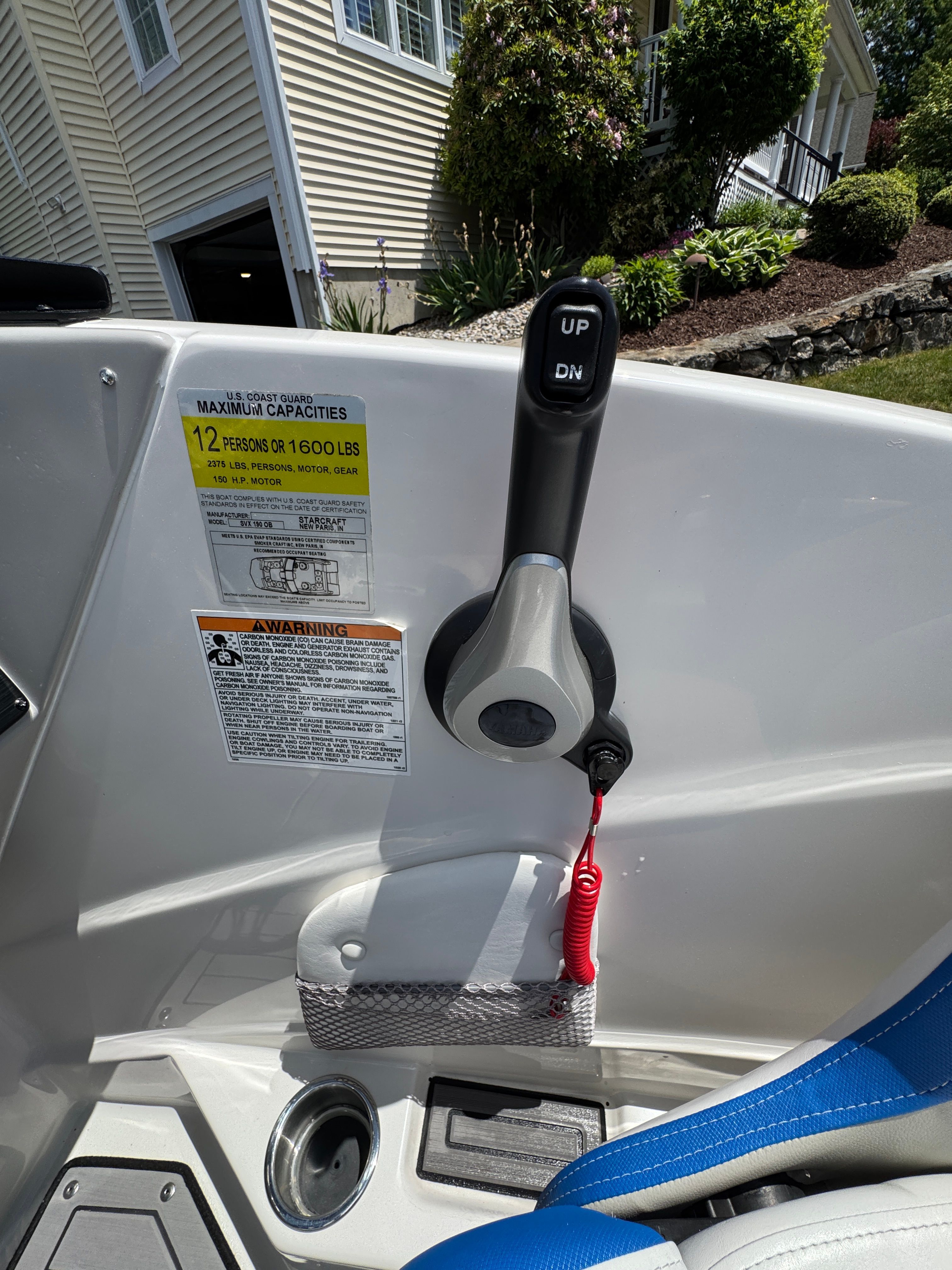 Interior view of a 2023 Starcraft SVX 190 OB boat with control lever.