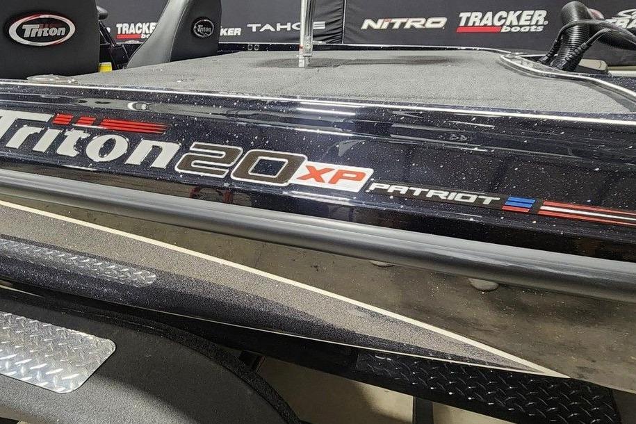 2026 Triton 20XP Patriot boat with sleek design and branding details.