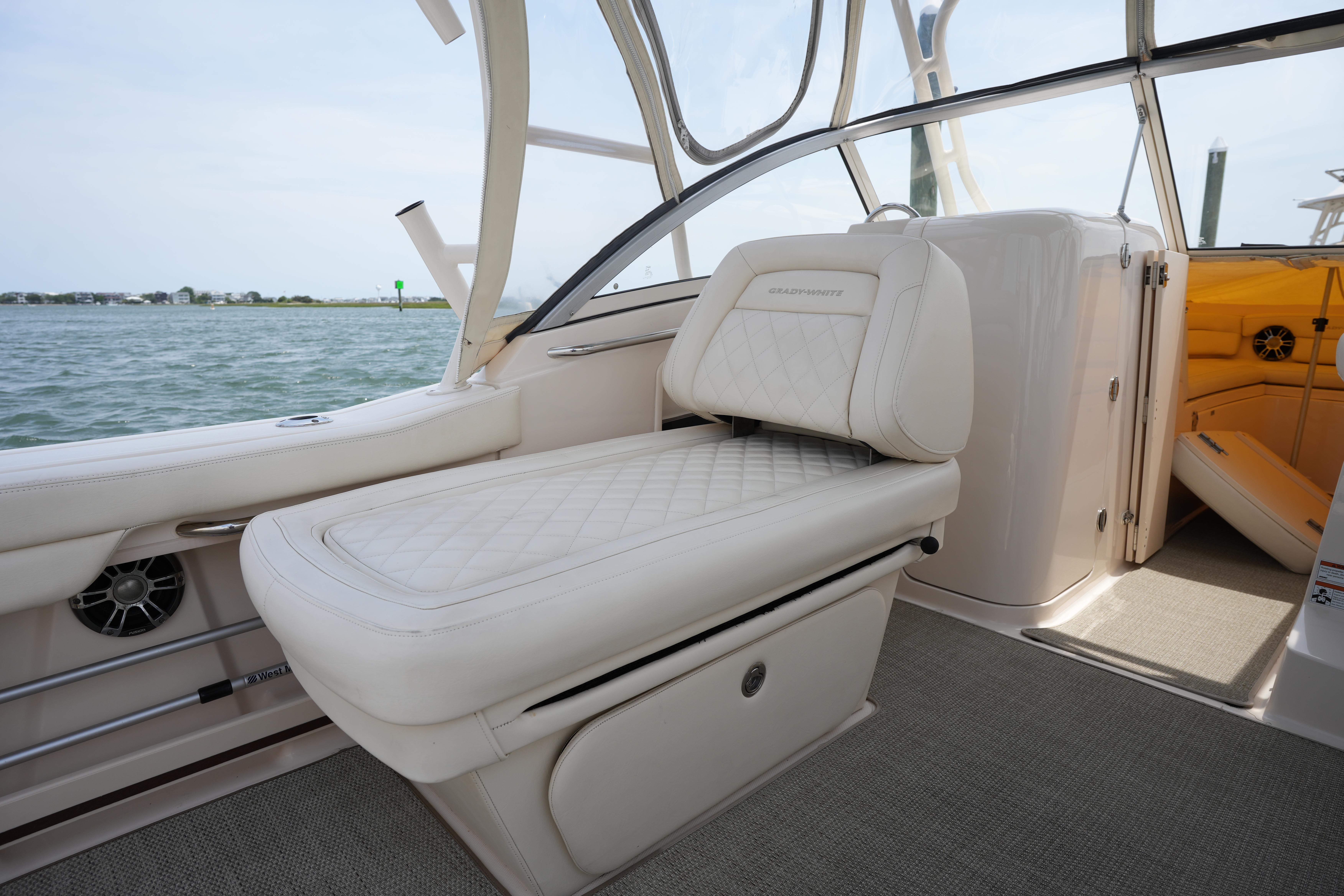 2021 Grady-White Freedom 235 boat interior with cushioned seating and water view.