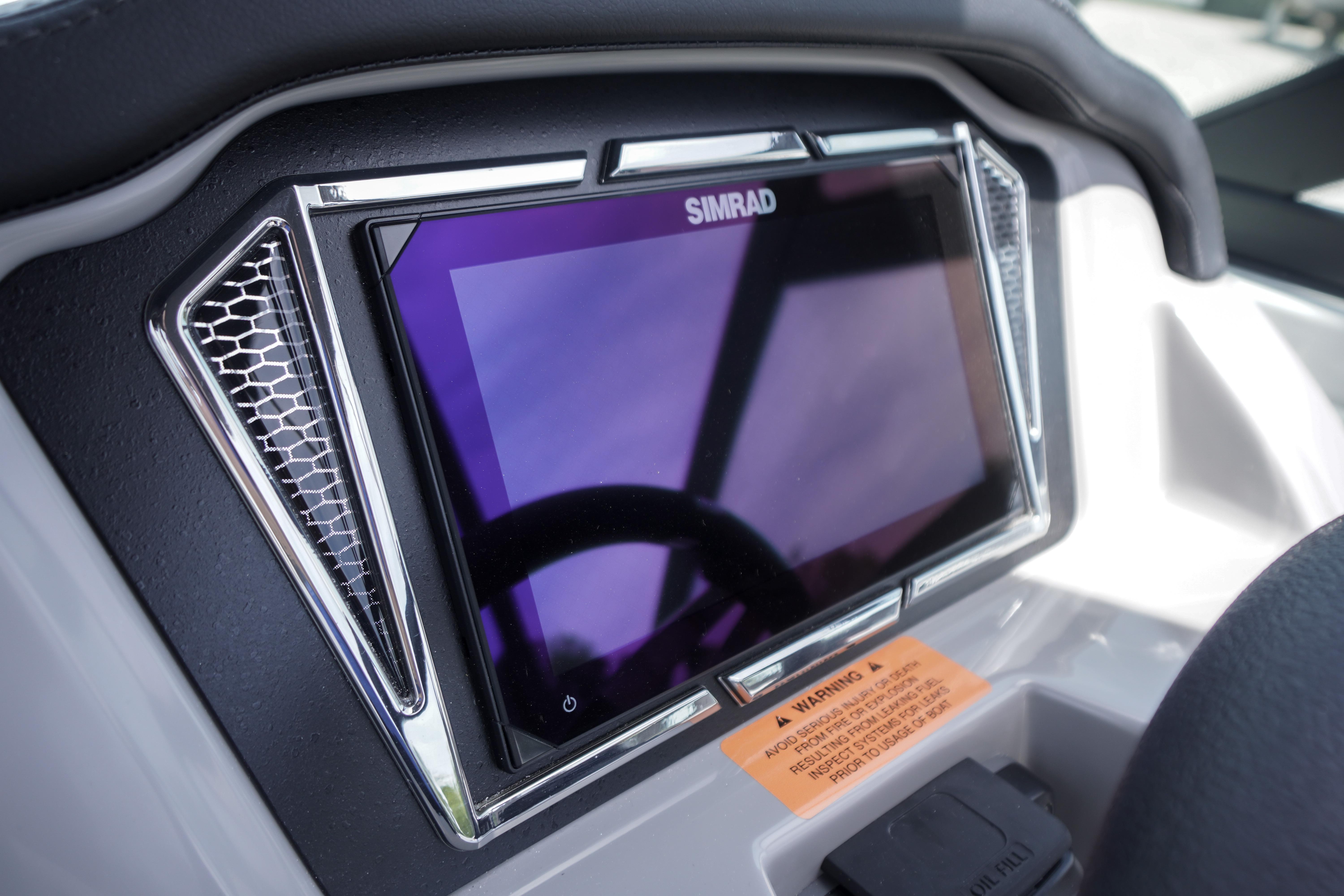 2026 Chaparral 23 SSi OB dashboard featuring a Simrad display screen.