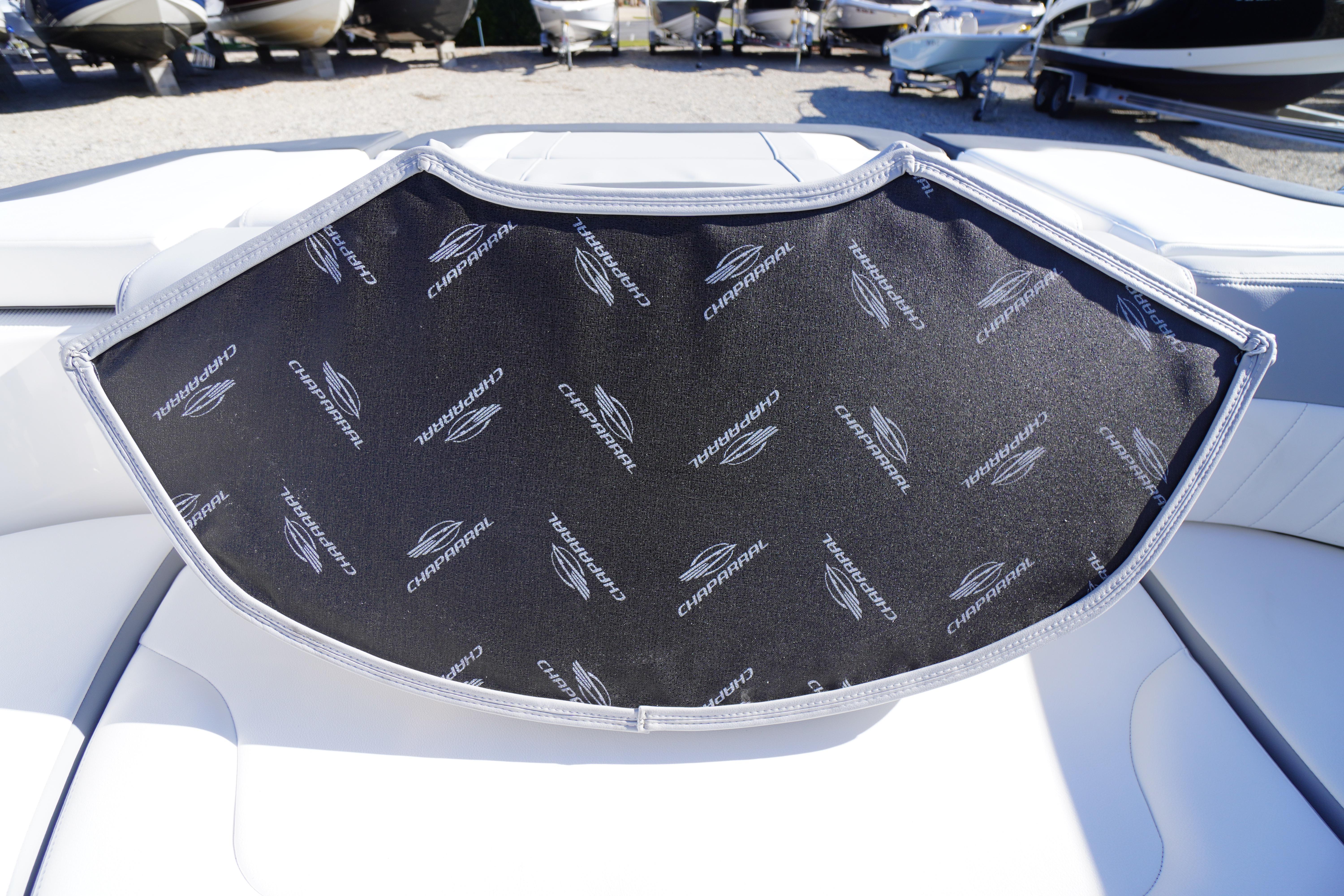 2026 Chaparral 23 SSi boat interior with branded cover, showcasing luxury design.