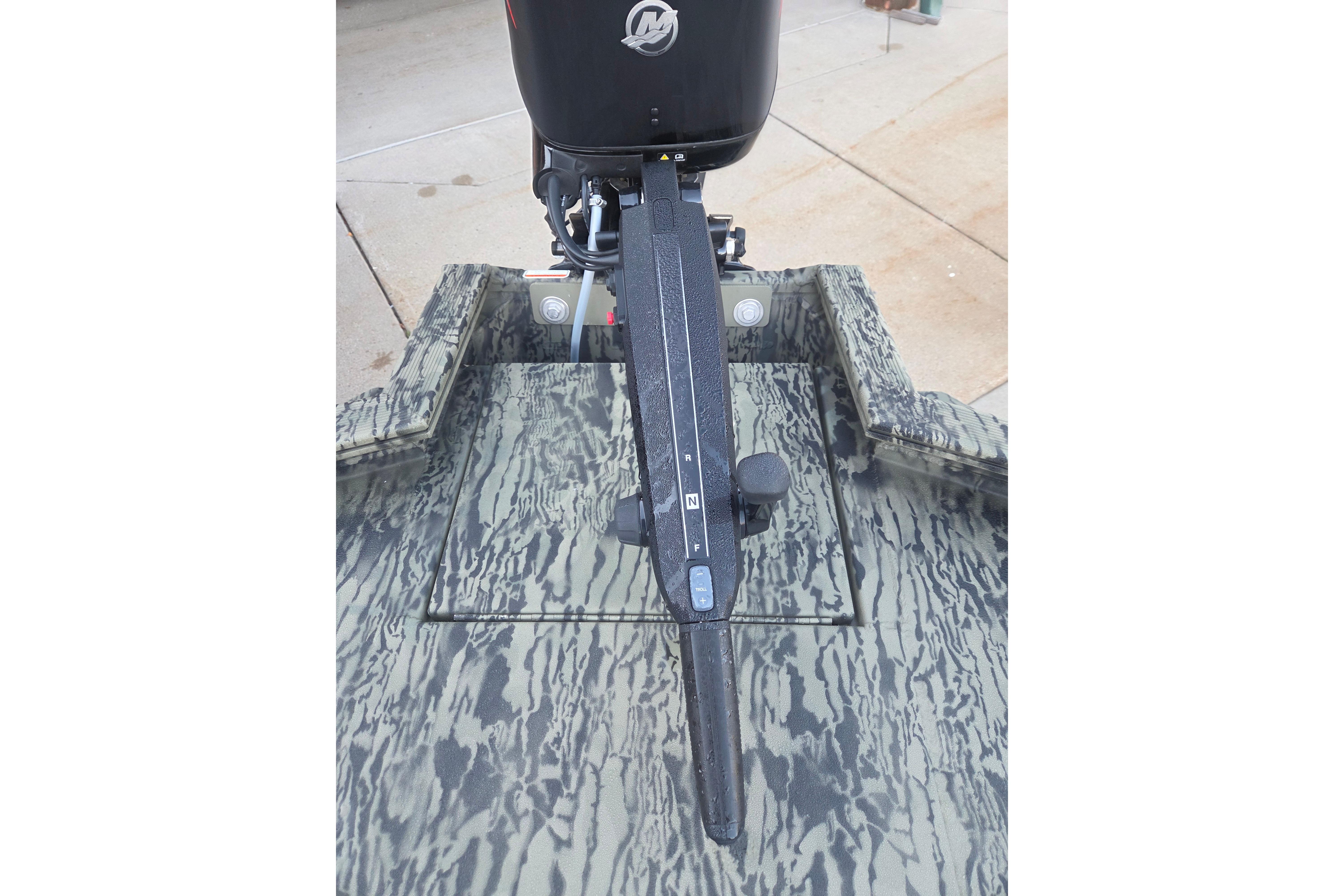 2026 Tracker Grizzly 1650 T Prairie Wings Edition boat with camouflage design and motor.