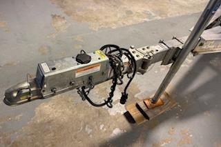 Trailer hitch mechanism for 2021 Scout 215 Dorado boat on concrete floor.
