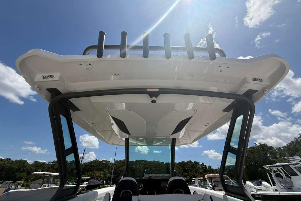 2026 Monterey Elite 30 OB boat with sleek design under sunny sky.