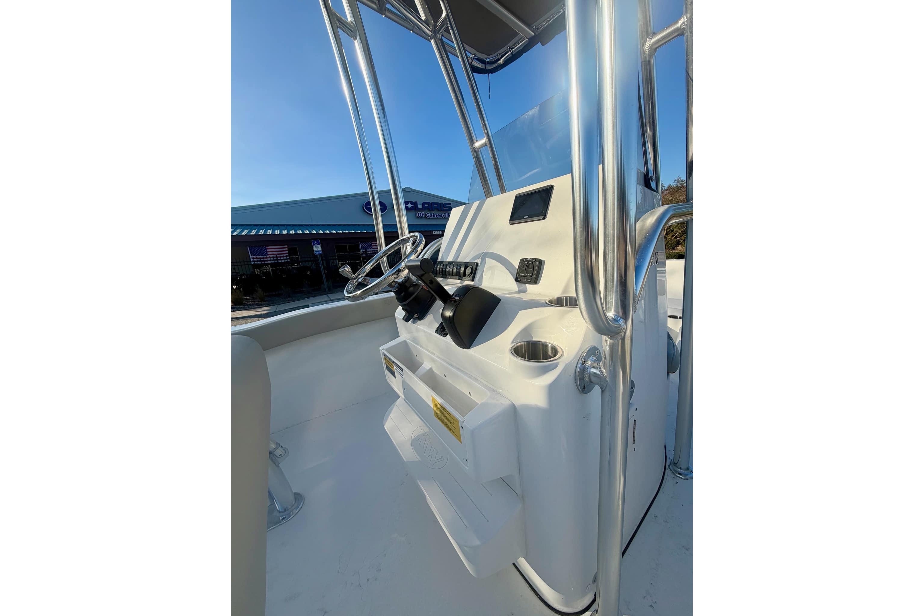 2026 Key West 203 FS boat console with steering wheel and controls.