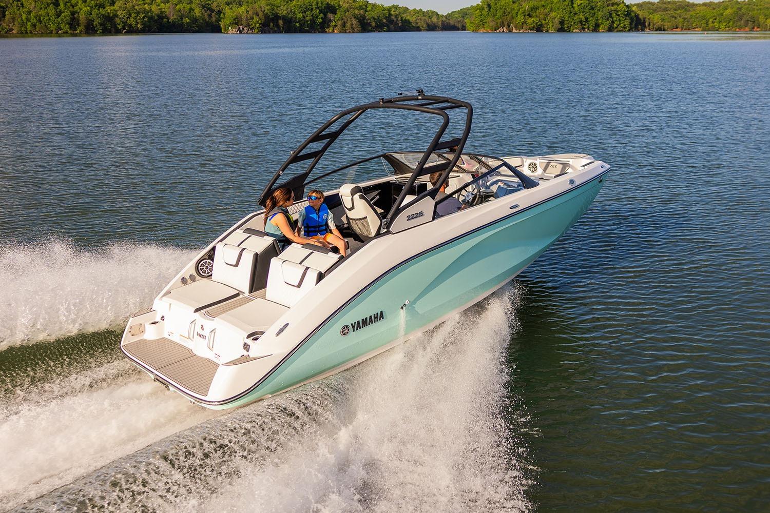 Manufacturer Provided Image: 2026 Yamaha Boats 222S cruising on a serene lake with passengers enjoying the ride.