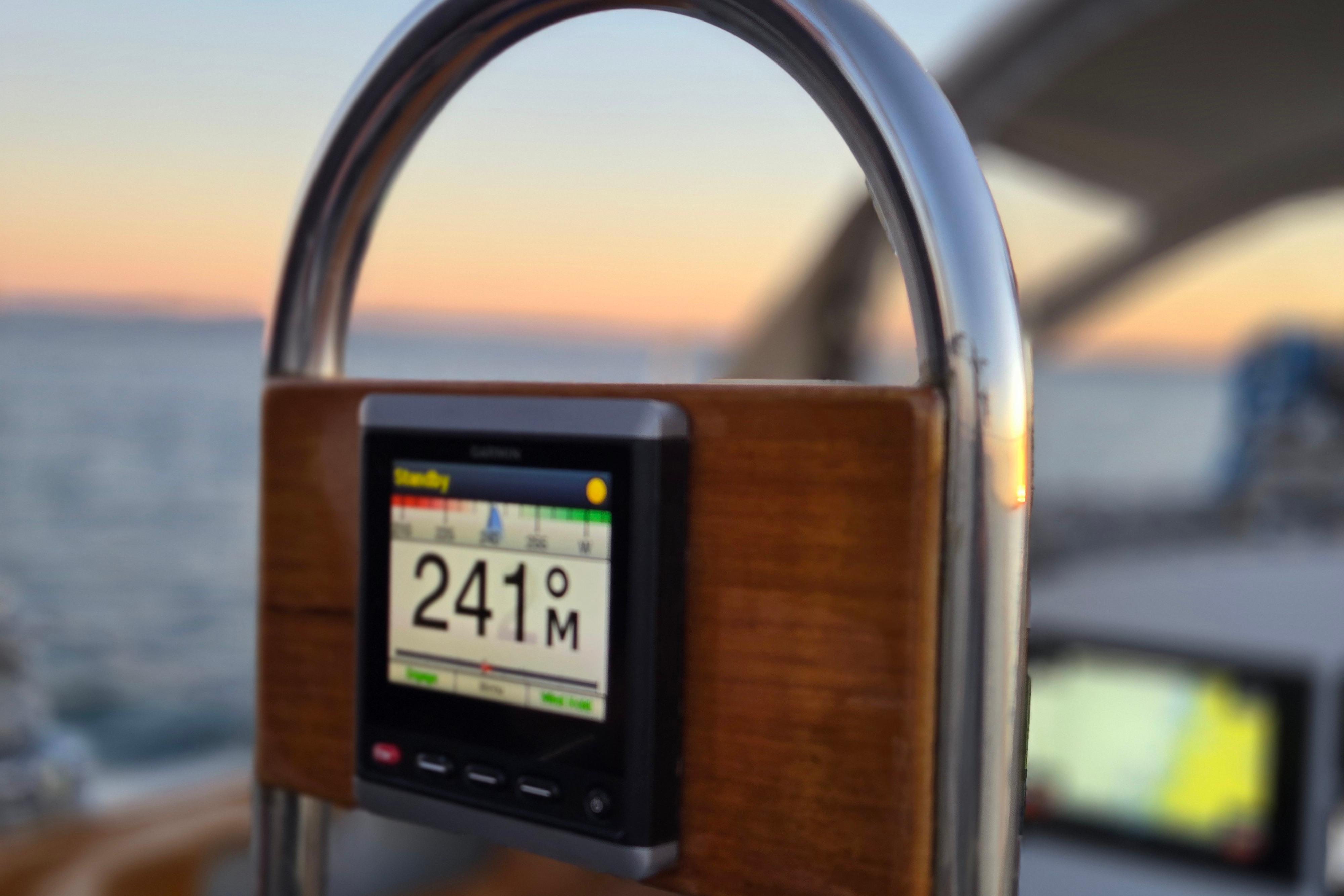 Close-up of a navigation display on a 1970 Hinckley Bermuda 40 sailboat at sunset.