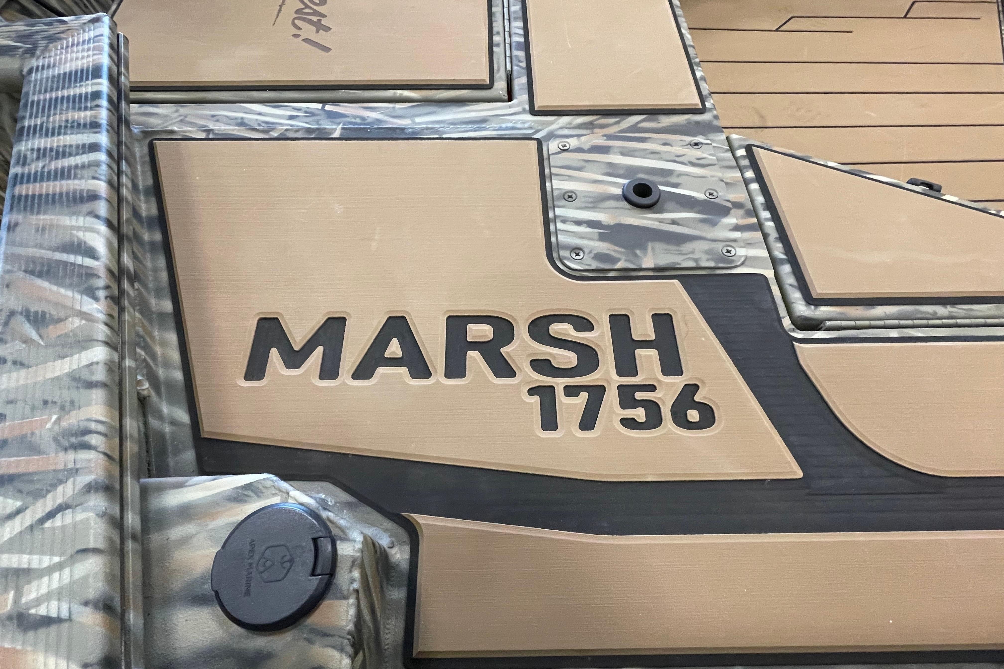 2026 Tracker Grizzly 1756 T Marsh boat deck with camouflage design.