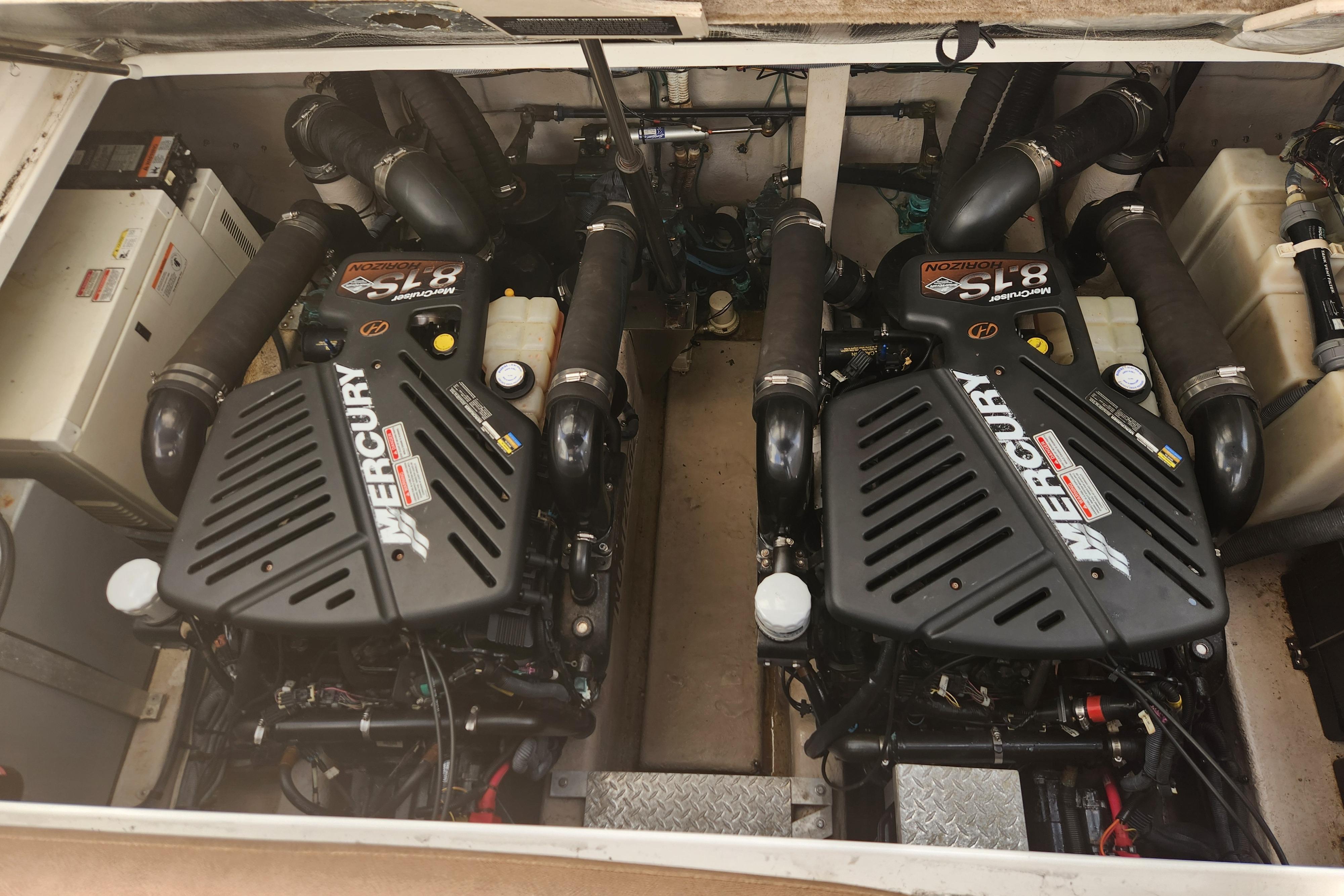 Engine compartment of a 2003 Sea Ray 360 Sundancer with twin Mercury engines.