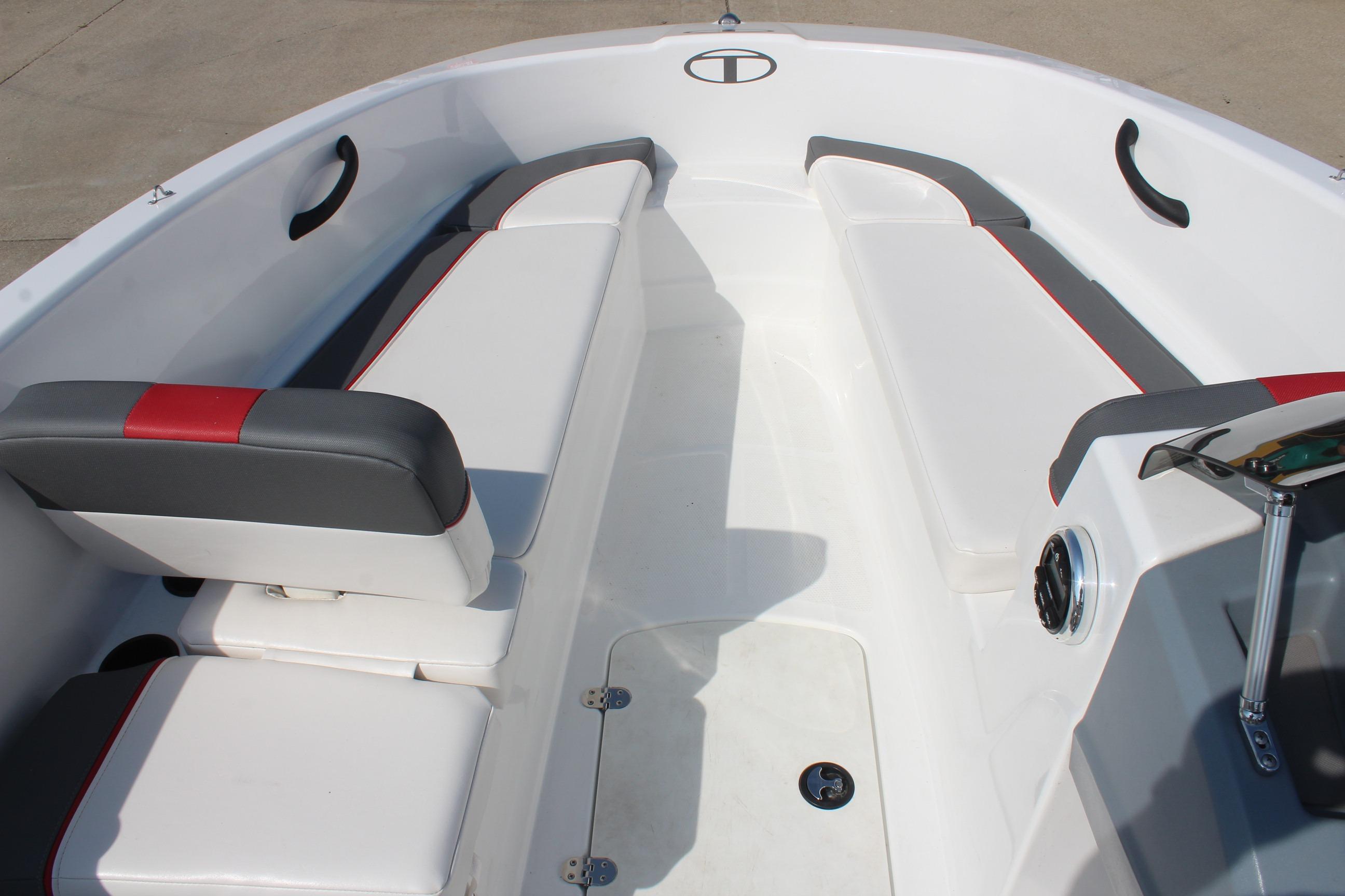 2023 Tahoe T16 boat interior with white and gray seating, red accents, and storage compartments.