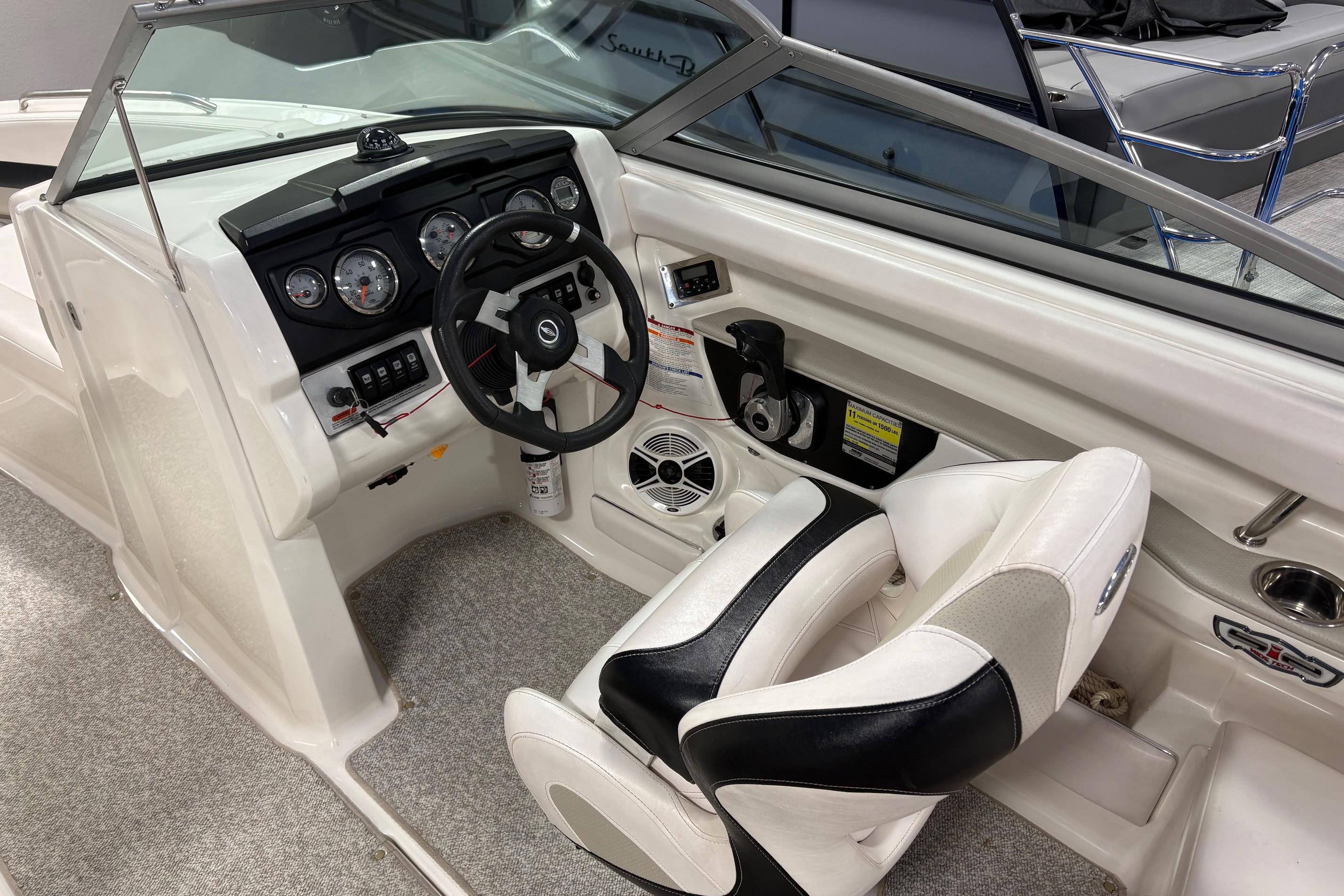 2011 Chaparral 216 SSi boat interior with steering wheel and dashboard controls.