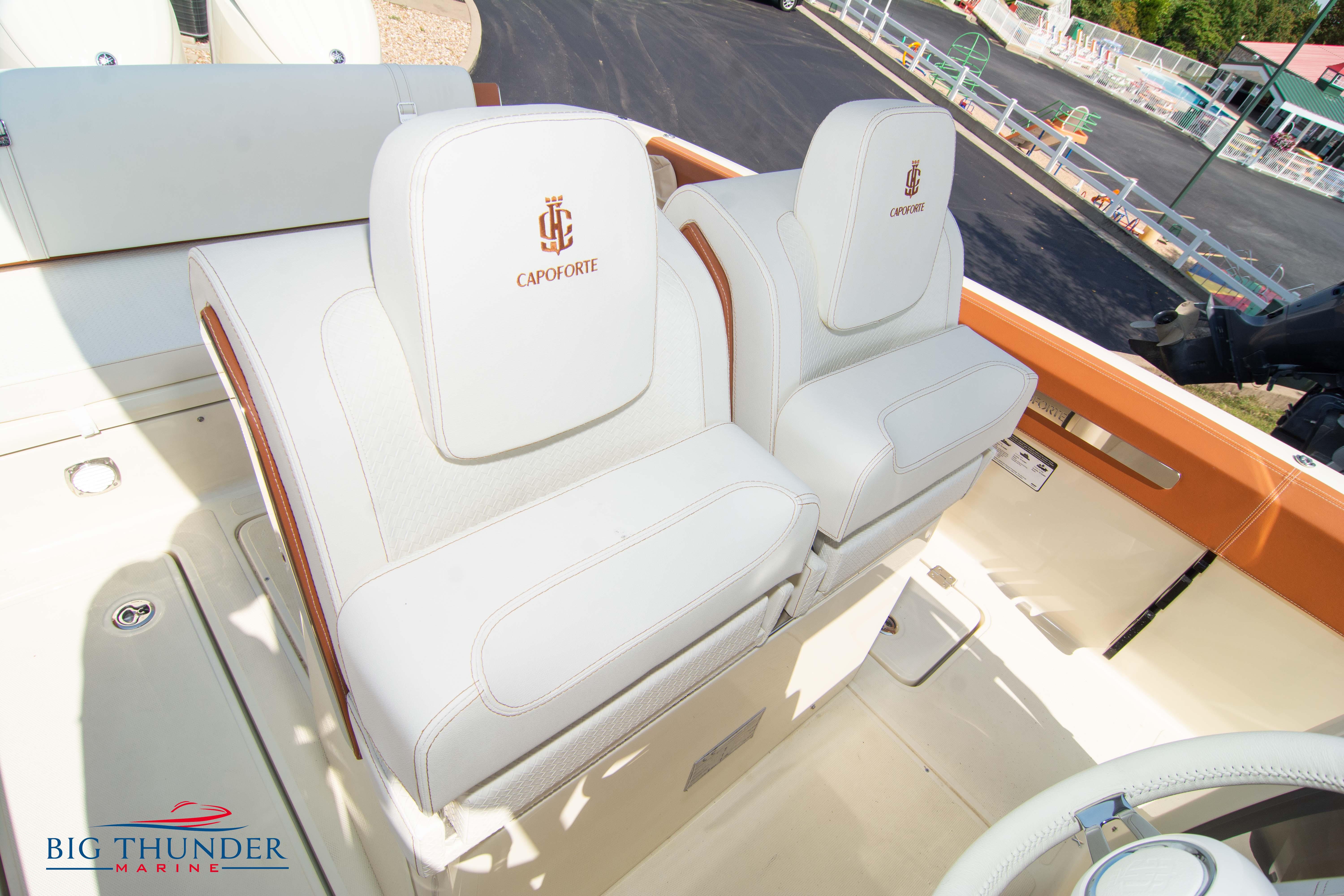 2024 Capoforte FX270 boat seats with white upholstery and logo detailing.