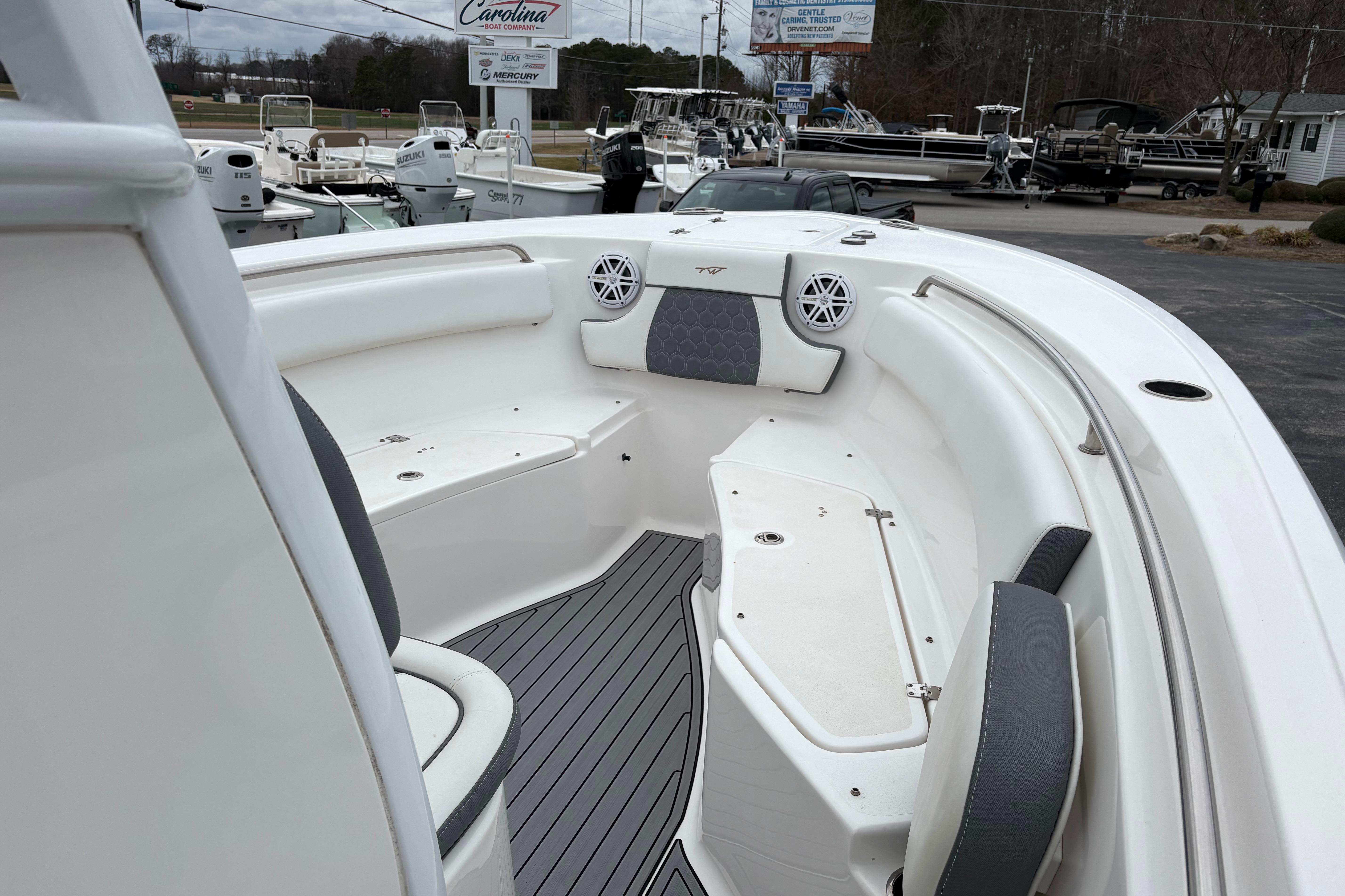 2019 Tidewater 232 CC Adventure boat interior with seating and speakers.
