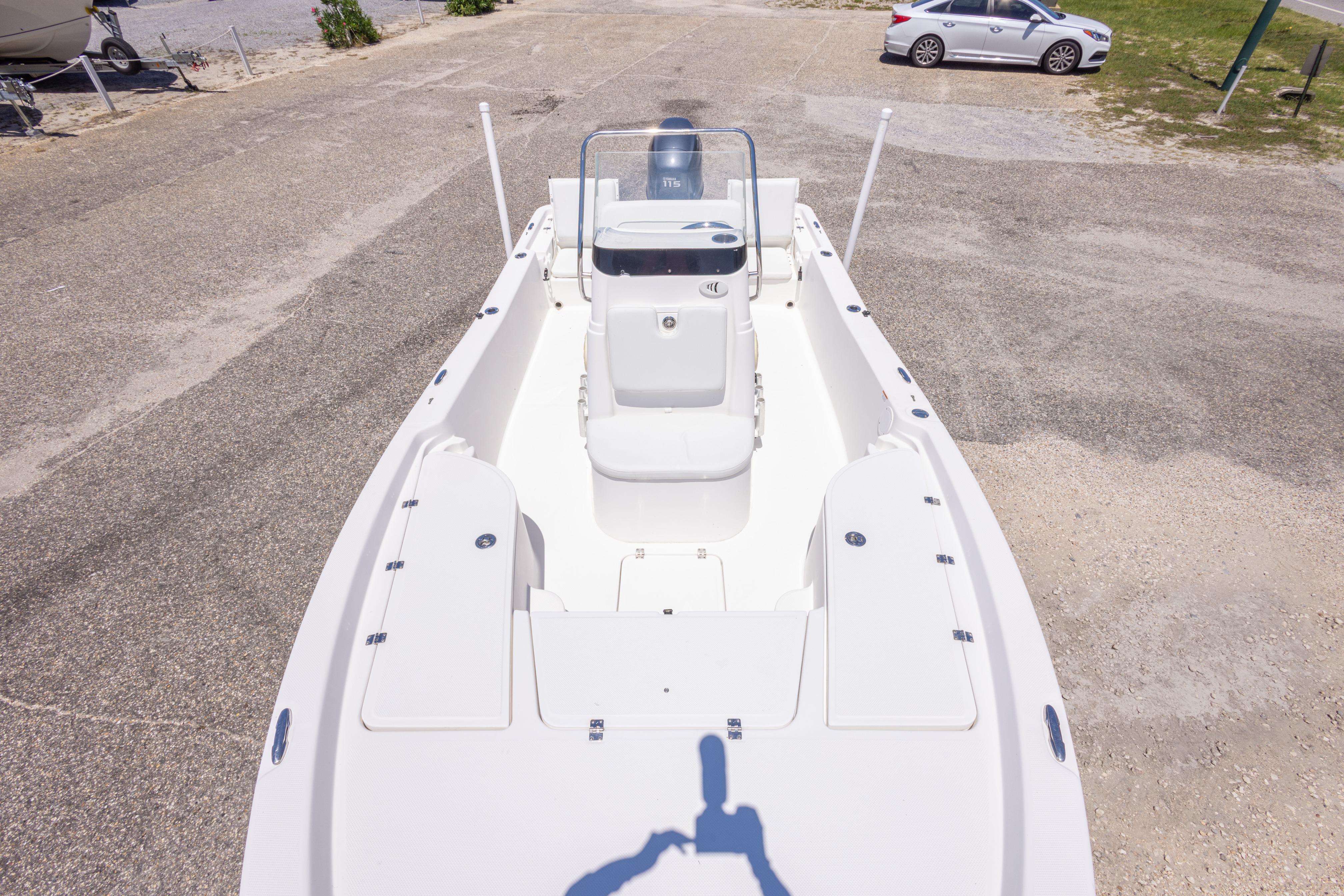 2011 Sea Fox 200XT boat on dry land, showcasing spacious deck and seating area.