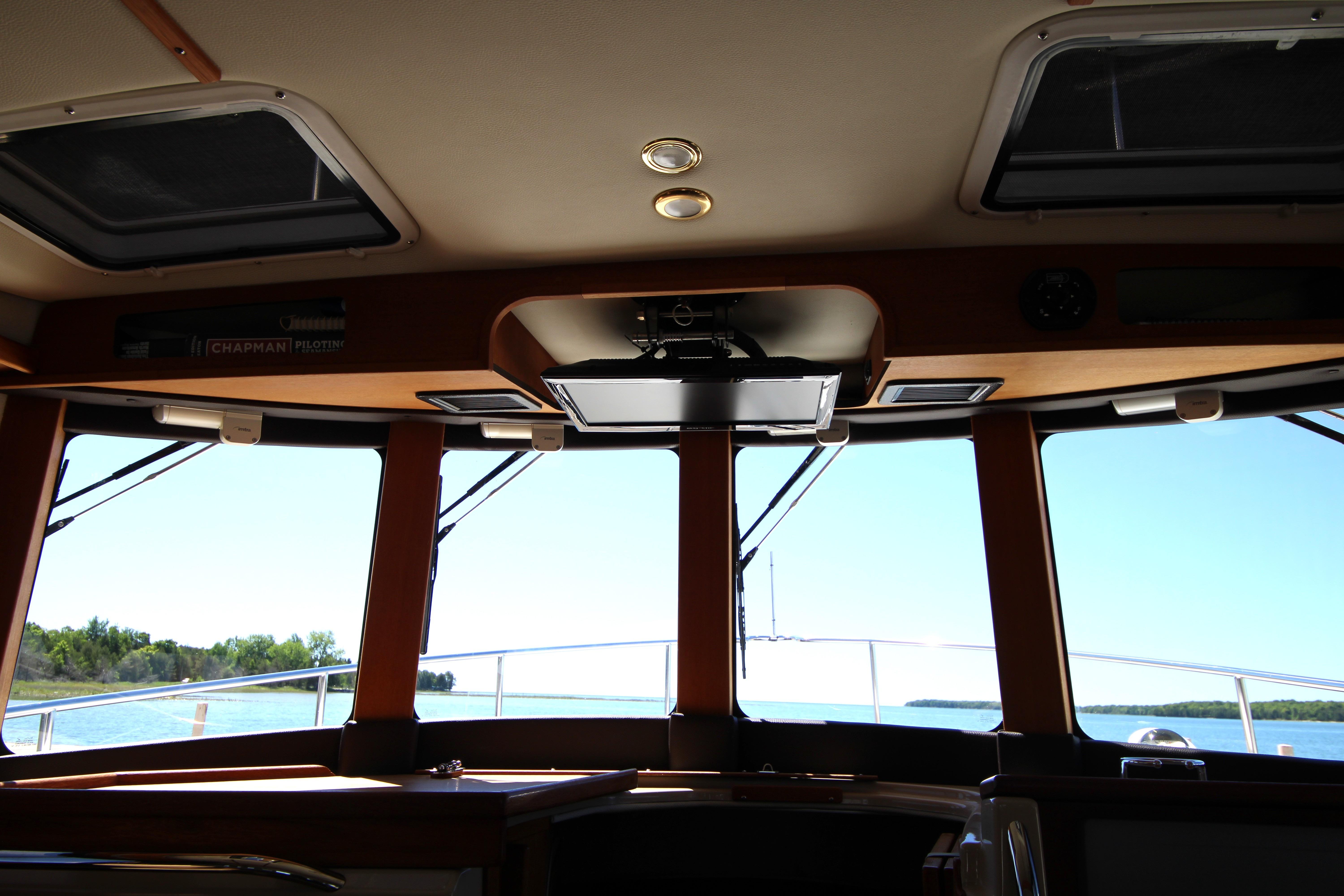 Interior view of 2013 Ranger Tugs R-31 CB boat with scenic water backdrop.
