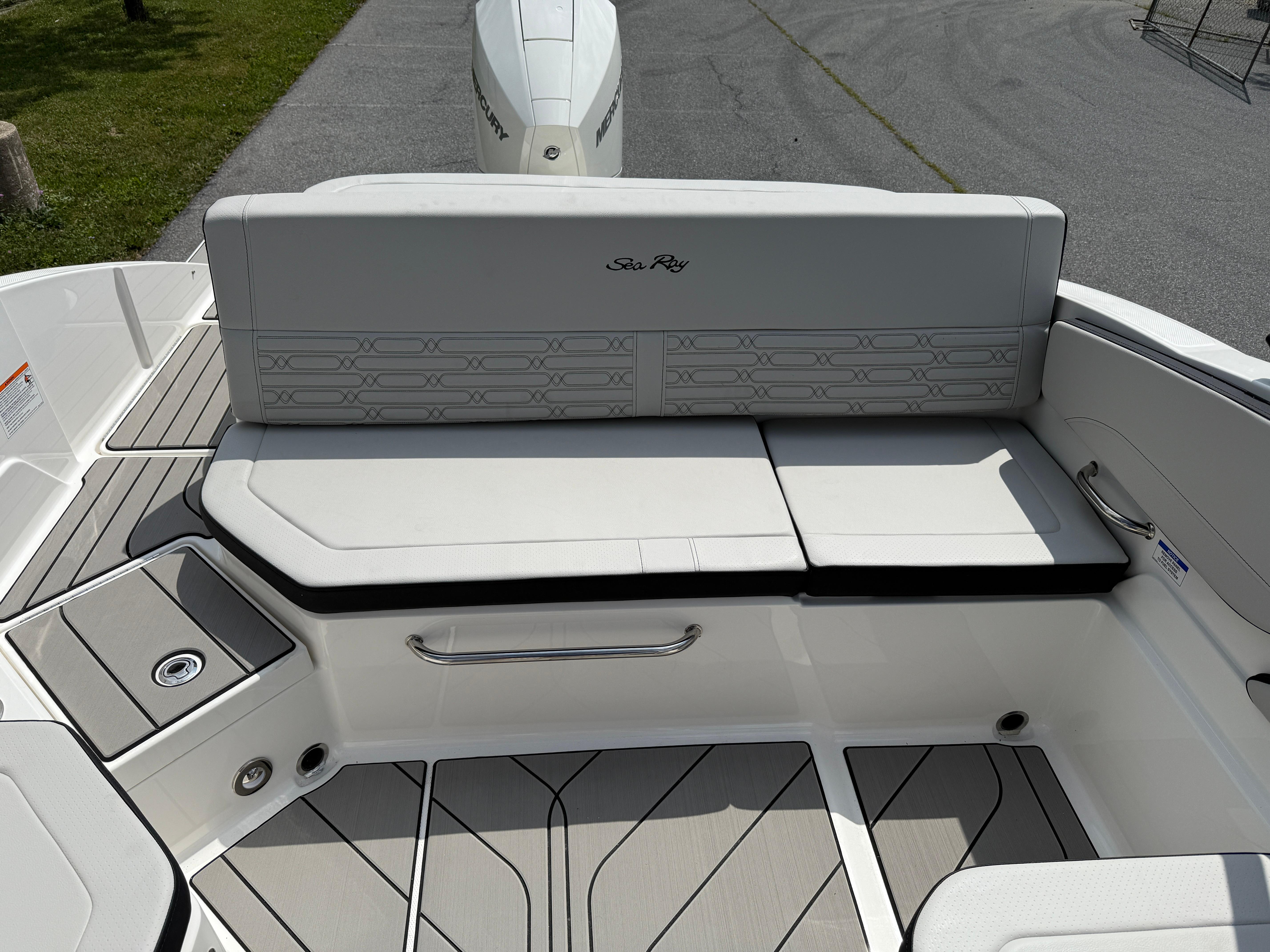 2026 Sea Ray SPX 210 Outboard boat interior with cushioned seating and sleek design.
