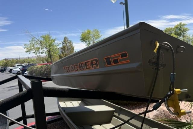 2026 Tracker Grizzly 12 Jon boat displayed outdoors on a sunny day.