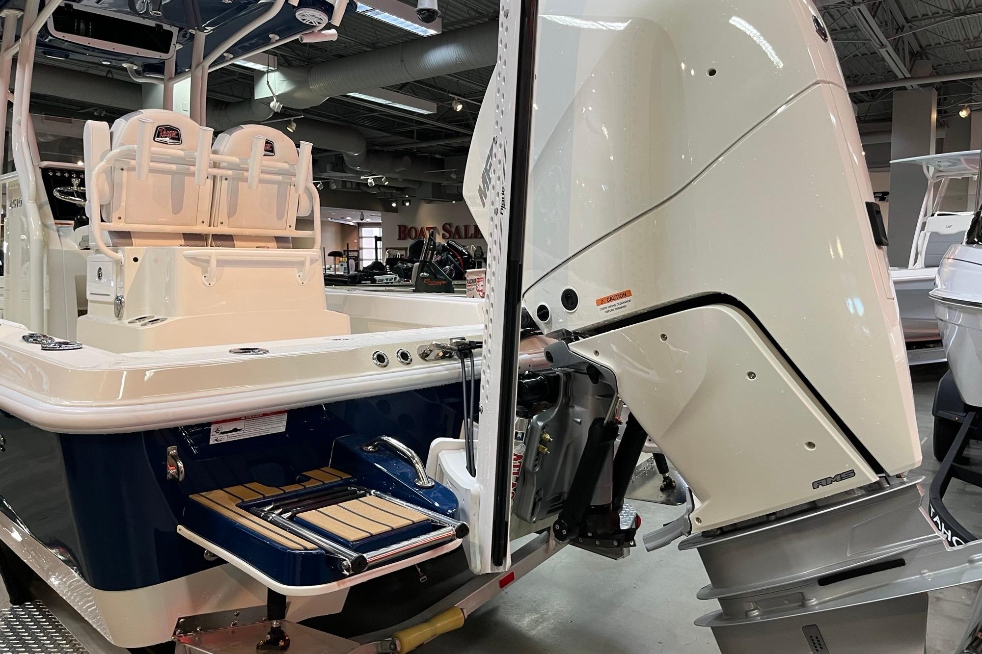 2026 Ranger 2510 Bay boat with powerful outboard motor in showroom display.