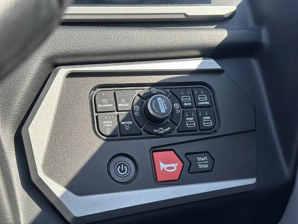 Control panel of 2025 Axis A225 boat with various function buttons and switches.