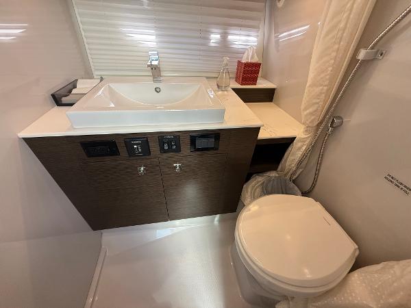 2020 Cruisers Yachts 38 GLS OB bathroom with modern sink and toilet.