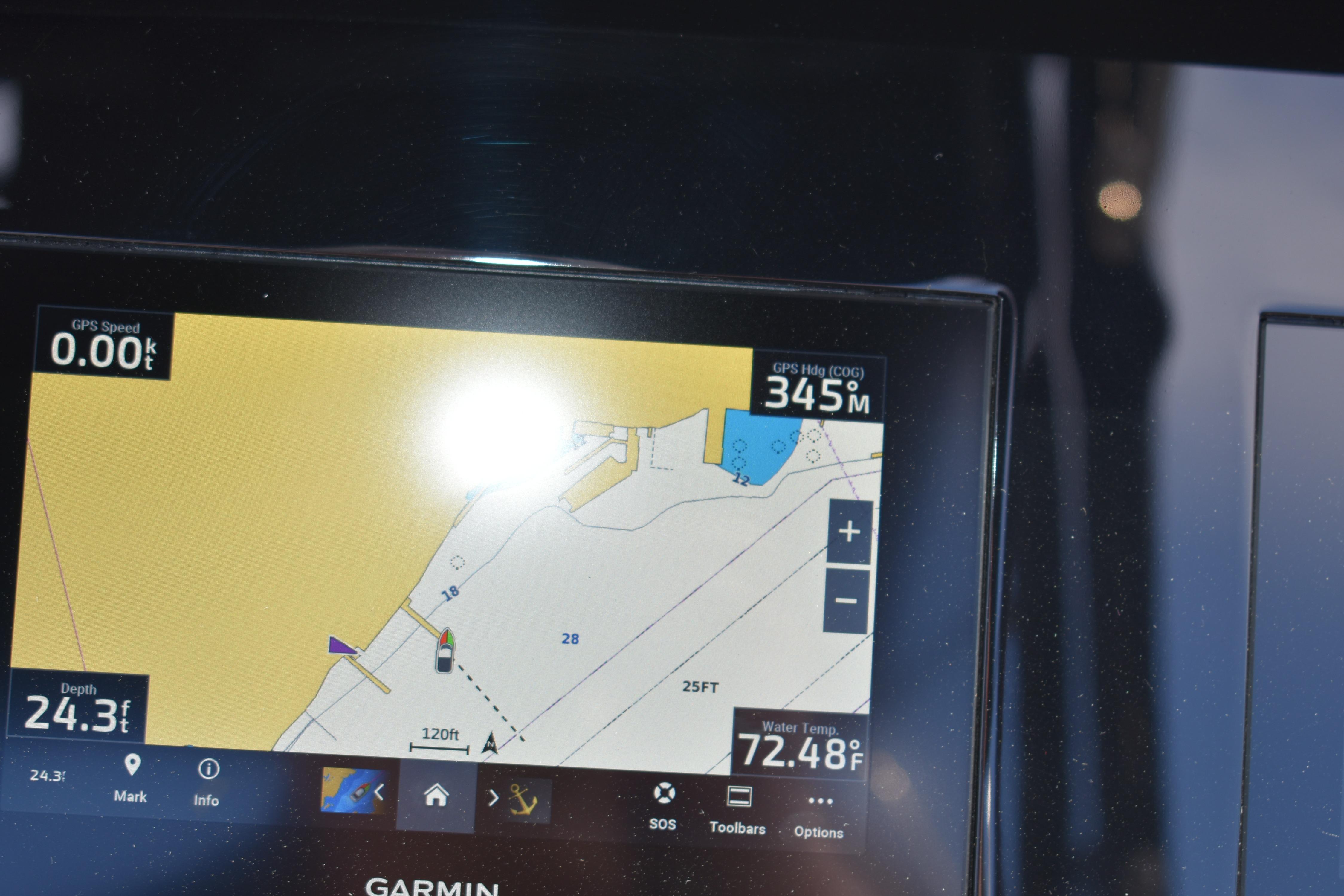 Garmin navigation display on 2023 Cobalt R8 showing GPS speed, heading, and water temperature.