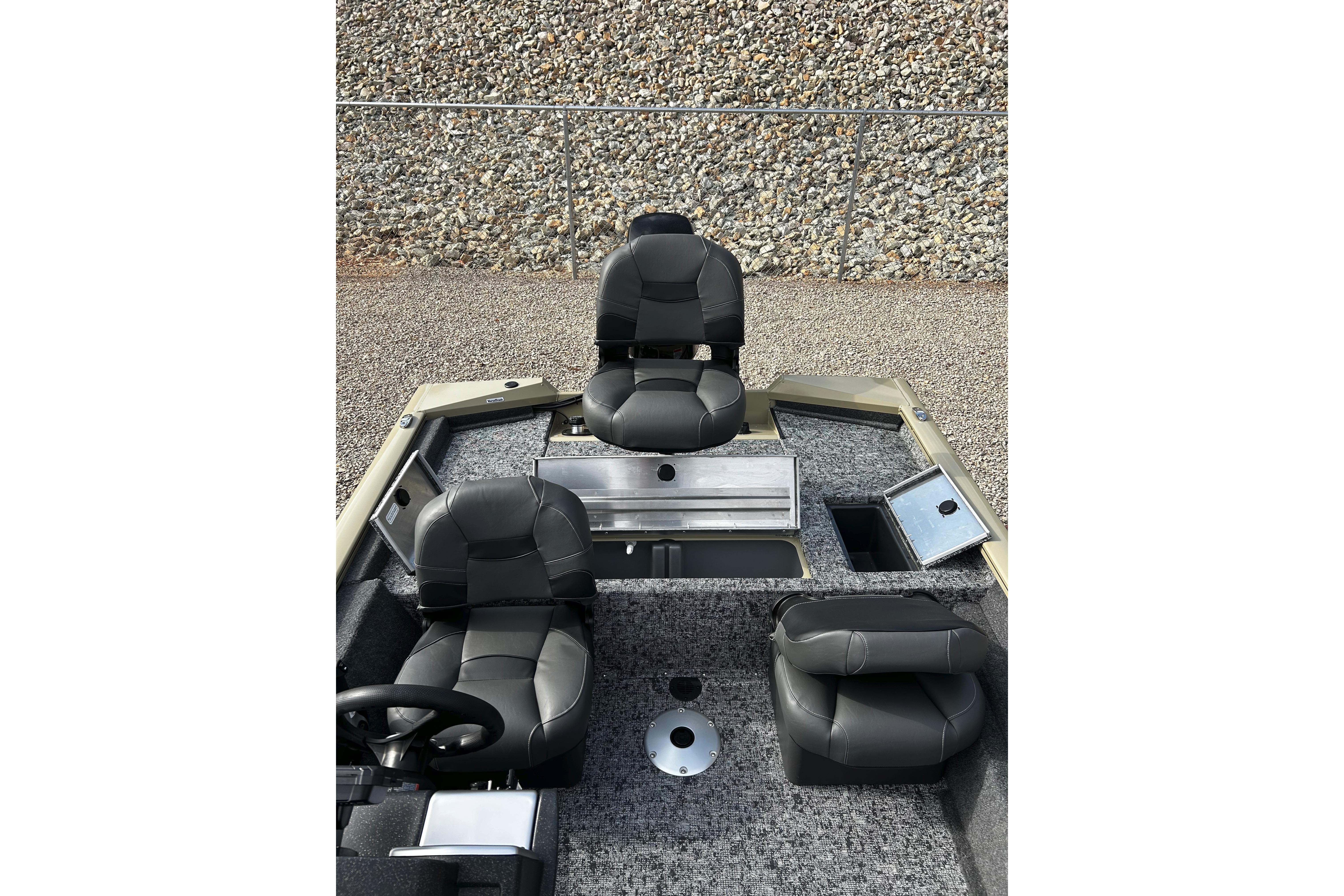 2026 Tracker Bass Tracker Classic CC boat interior with seating and storage compartments.