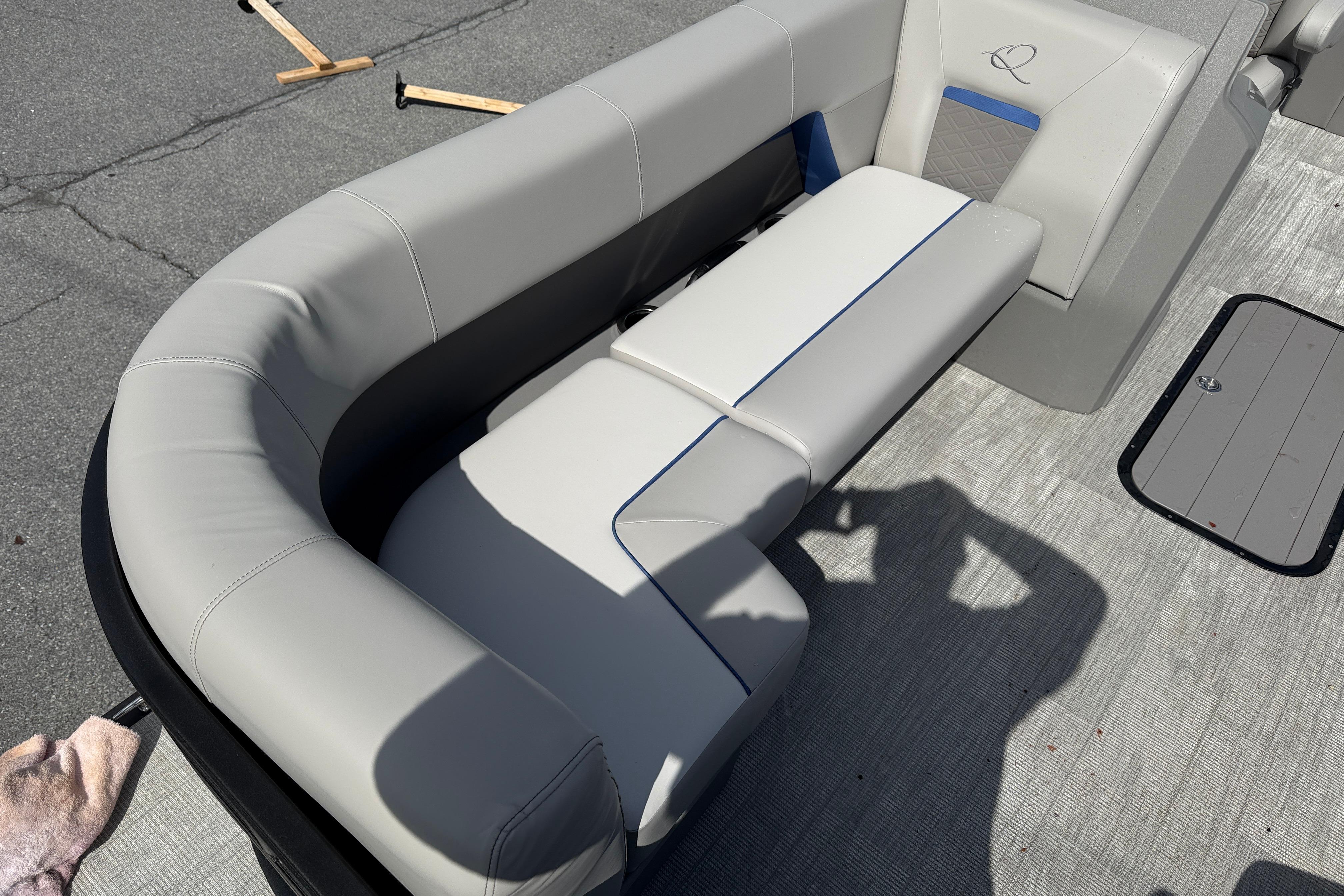 Interior of 2025 Qwest SplashPad 22 Performance TriToon with gray upholstery.