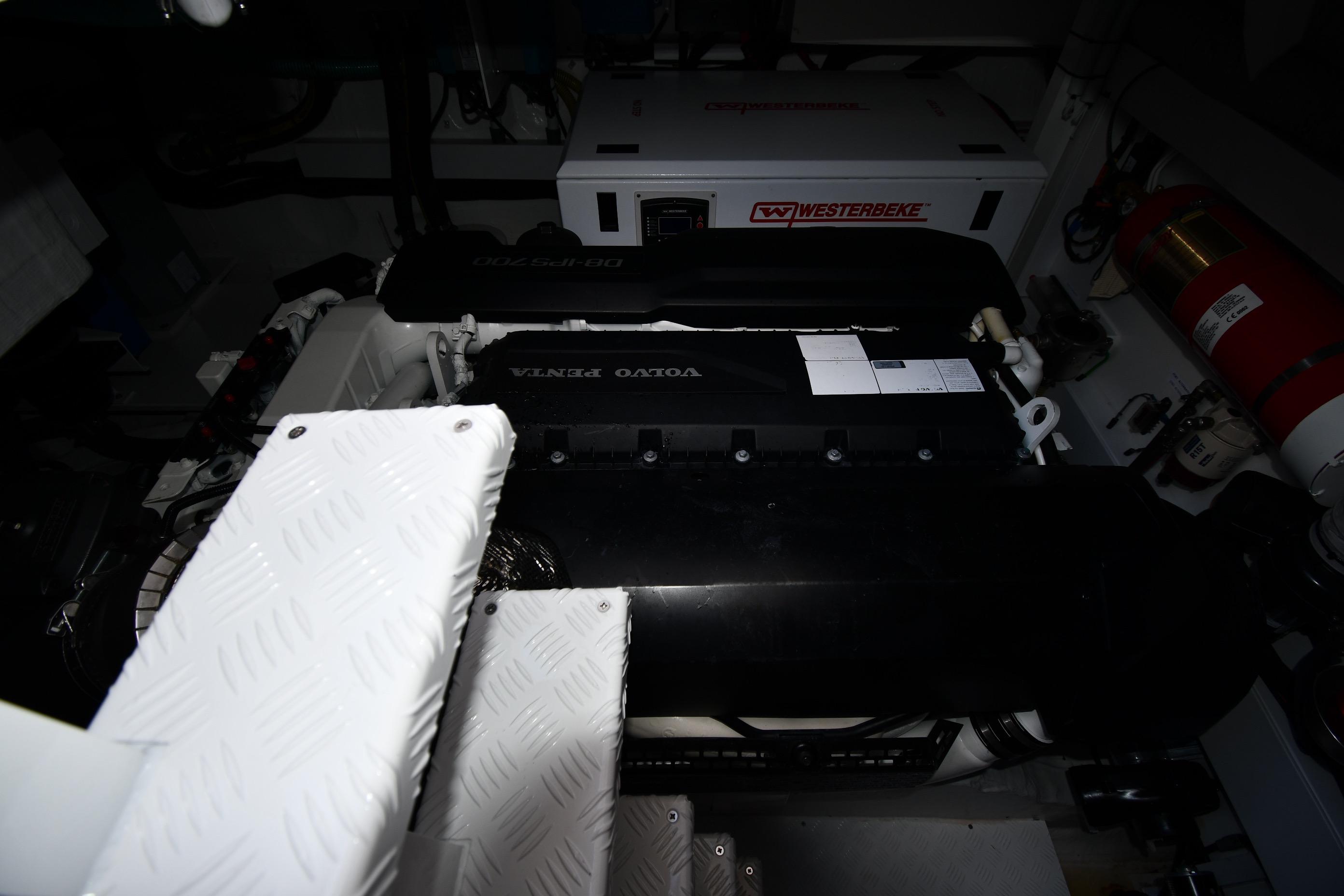 Engine room of 2024 Fairline G50 Targa yacht featuring Volvo Penta engine and Westerbeke generator.