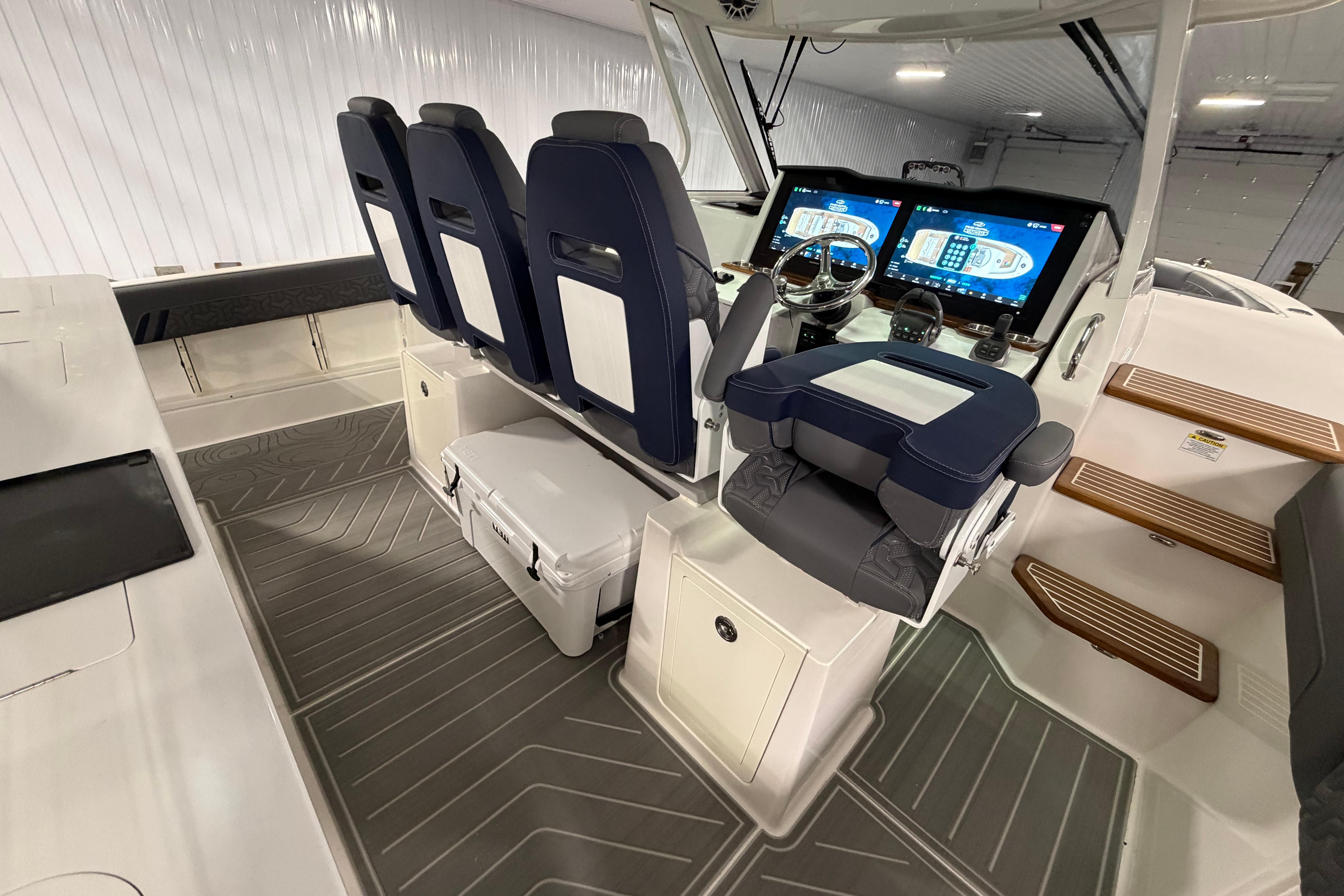 2027 Regal 38 Surf boat interior with modern helm, dual screens, and comfortable seating.