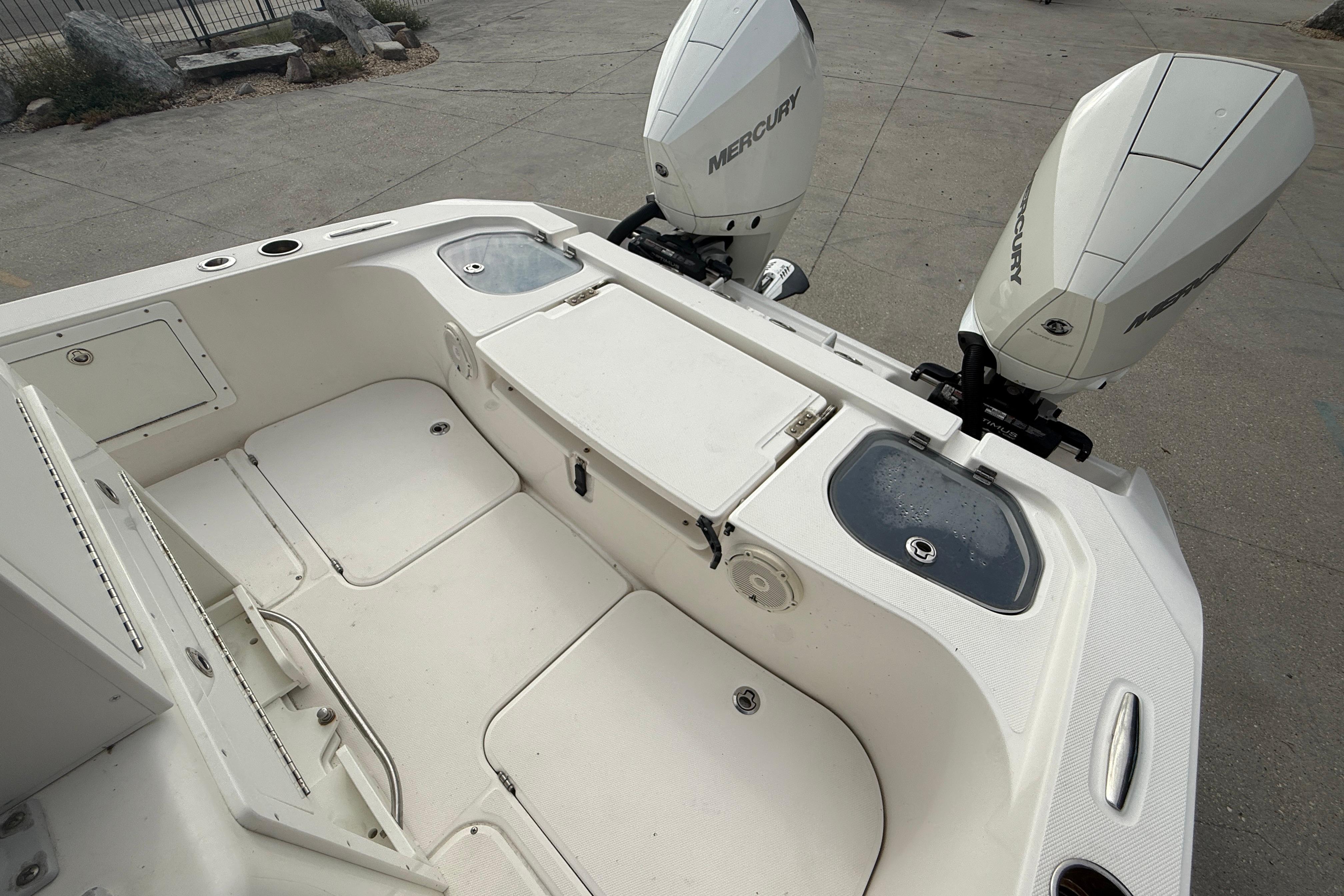 2021 Sea Cat 260 boat with dual Mercury engines, spacious deck, and storage compartments.
