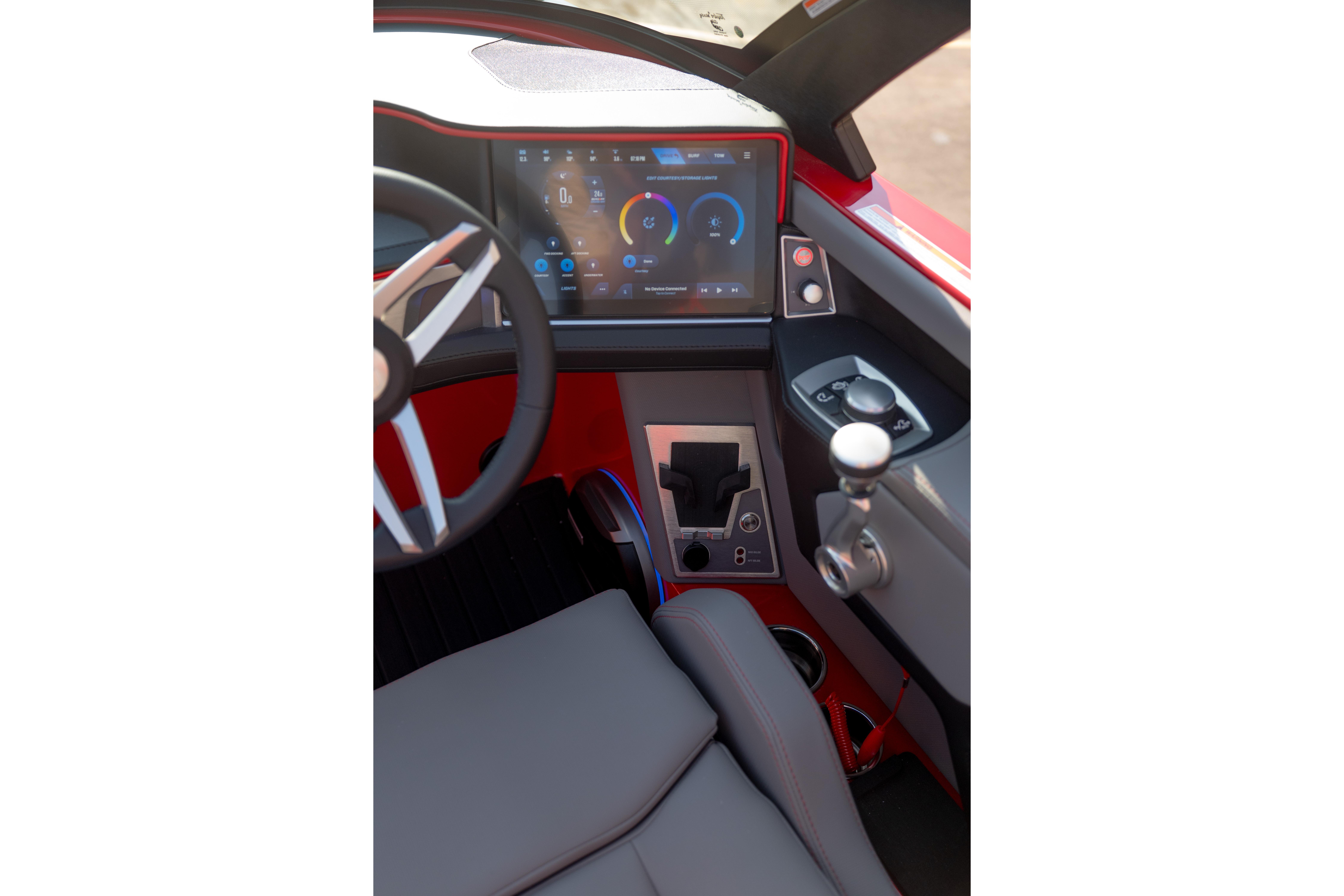2027 MasterCraft XT24 boat cockpit with modern dashboard and steering wheel.