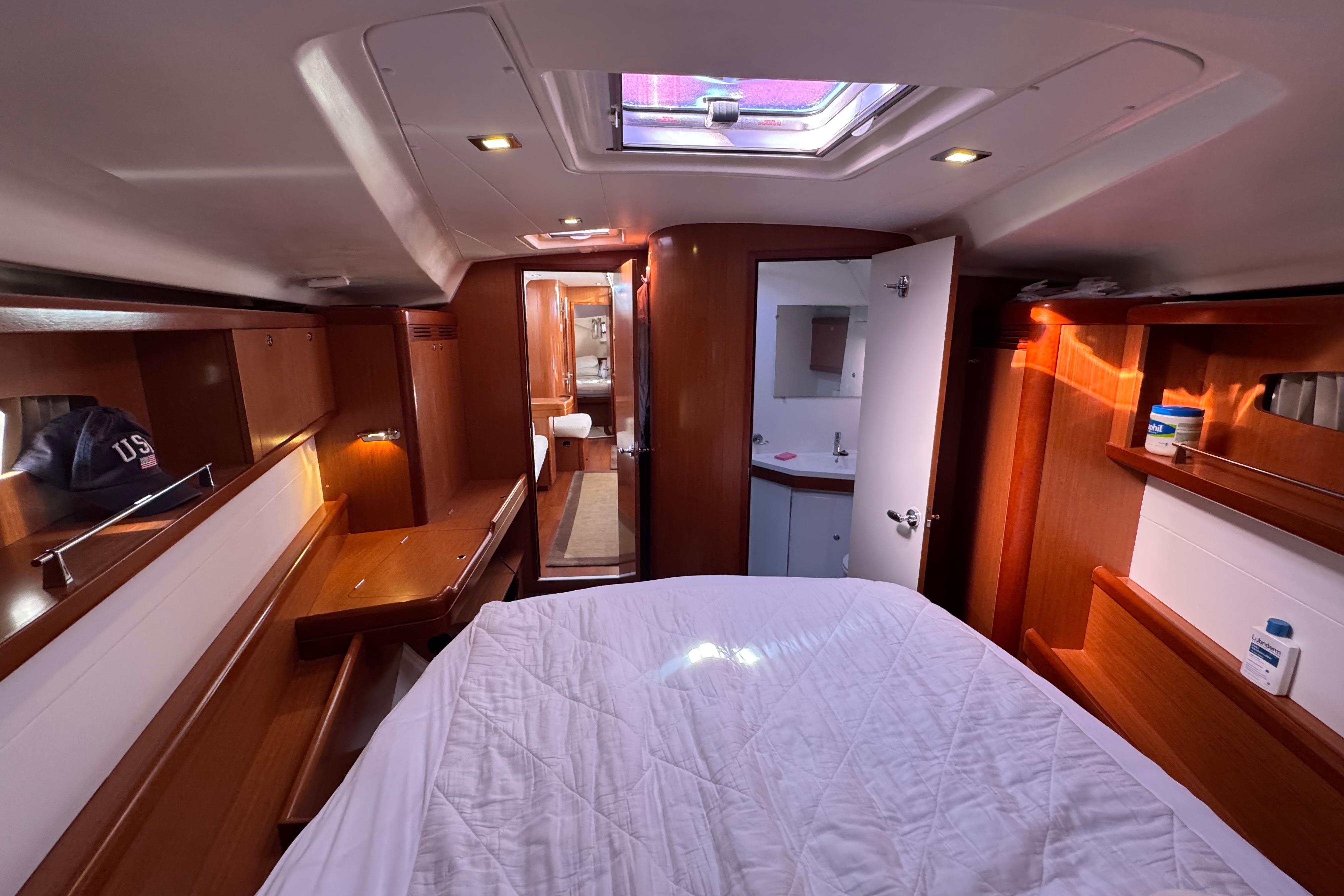 Luxurious 2009 Benetea 49 yacht cabin with wood finish and natural light.