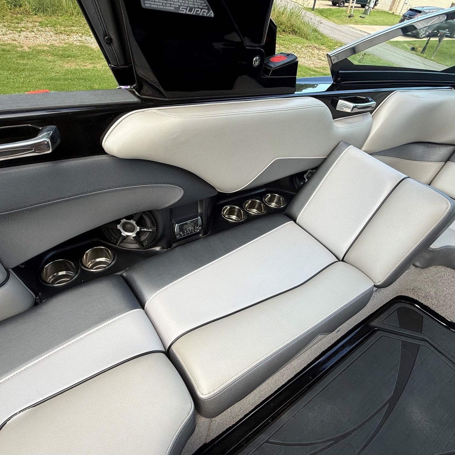 Interior of a 2014 Supra SC350 boat with gray upholstery.