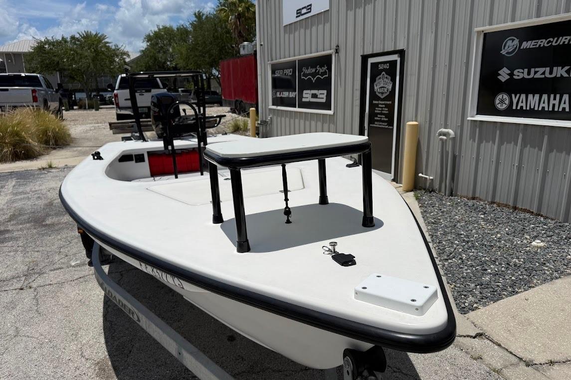 2024 Delta Boatworks Delta D18 boat parked outside a dealership, showcasing sleek design.