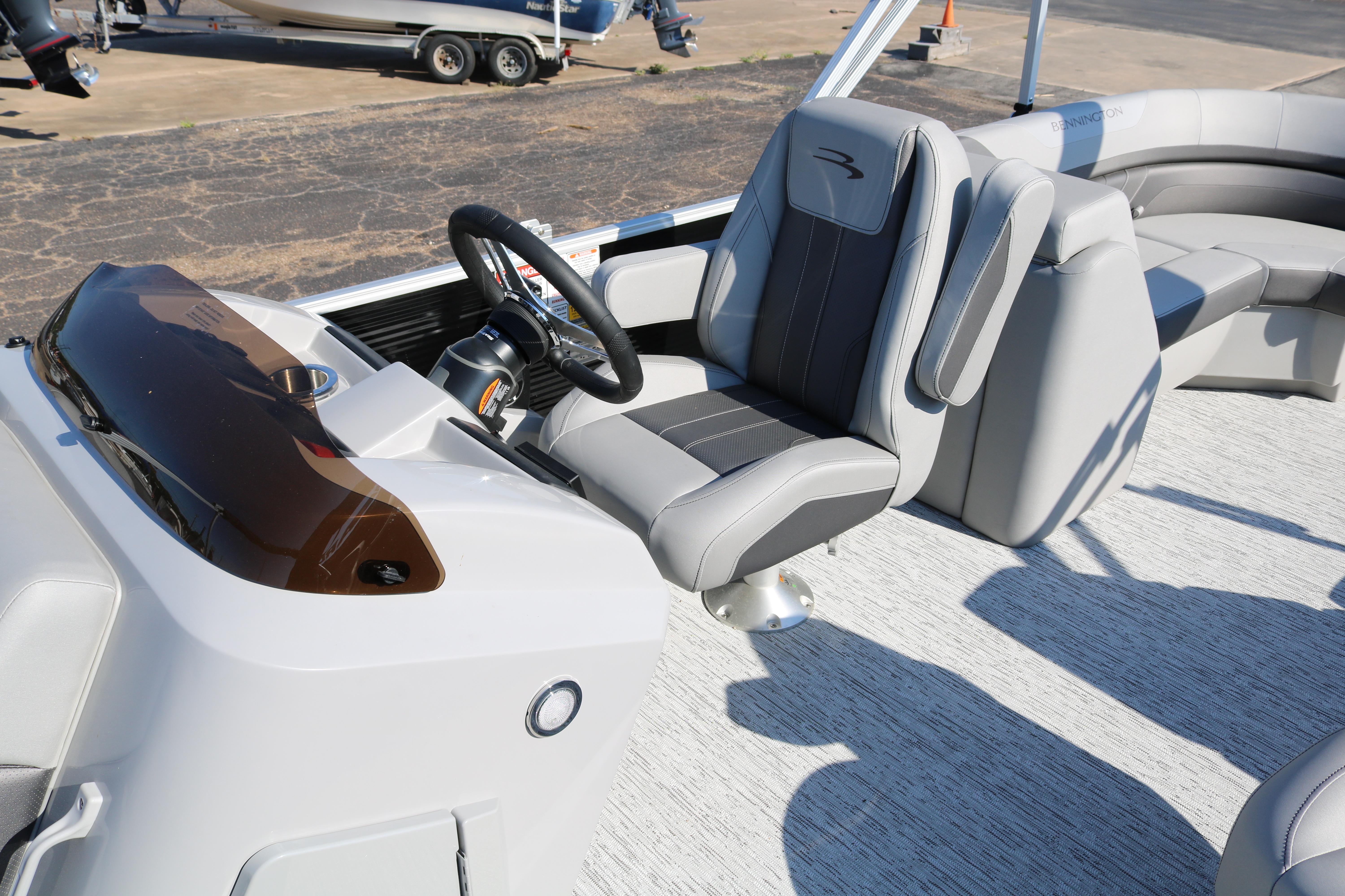 2026 Bennington 22SX Stern Radius boat interior with modern steering and seating.