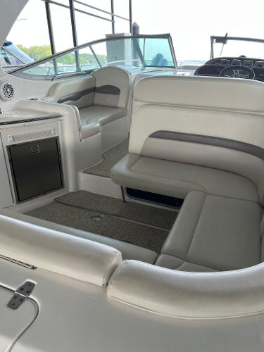 Interior of a 2008 Chaparral Signature 310 boat with beige seating.