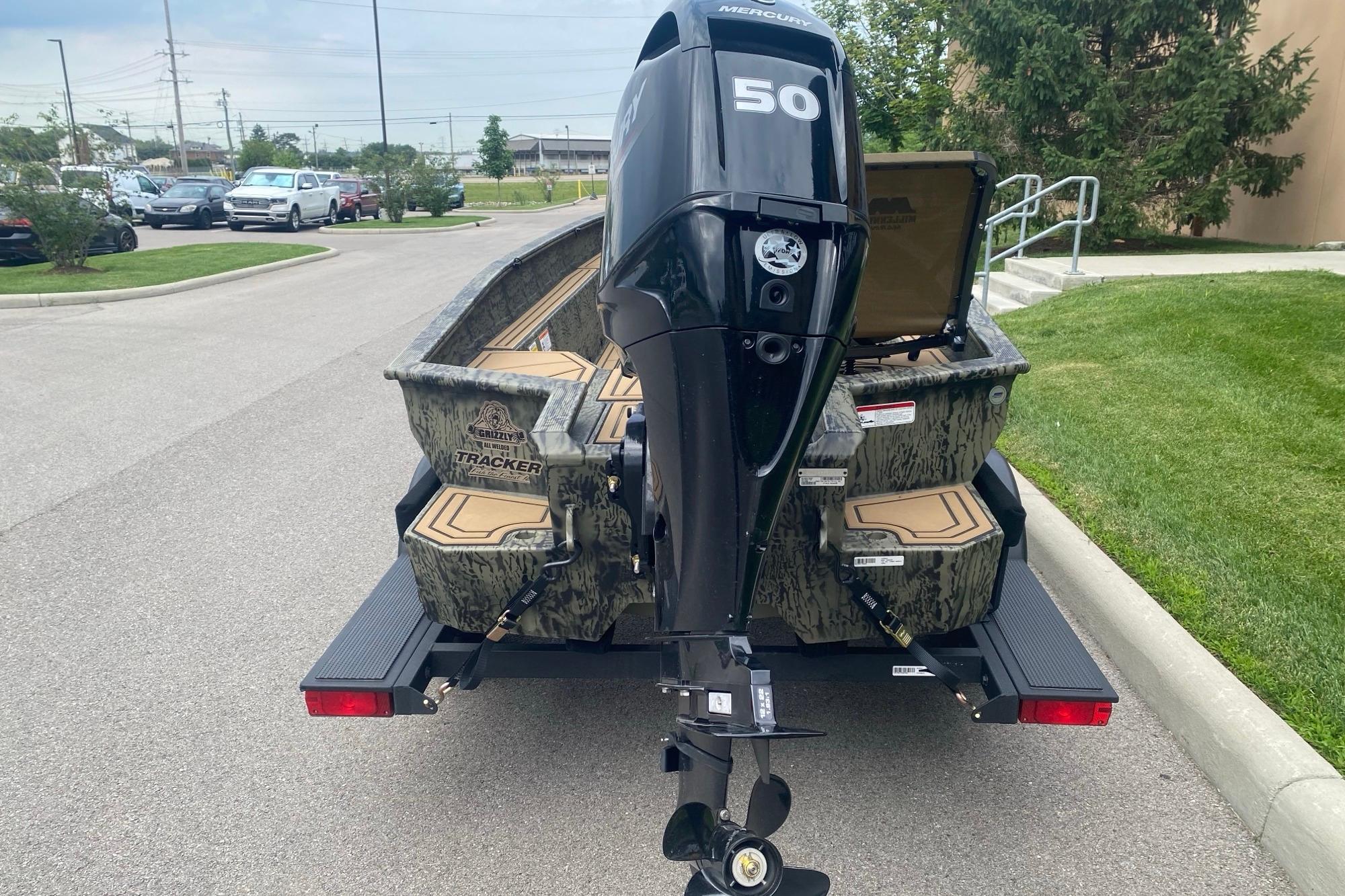2026 Tracker Grizzly 1650 T Prairie Wings Edition boat with Mercury 50 outboard motor.