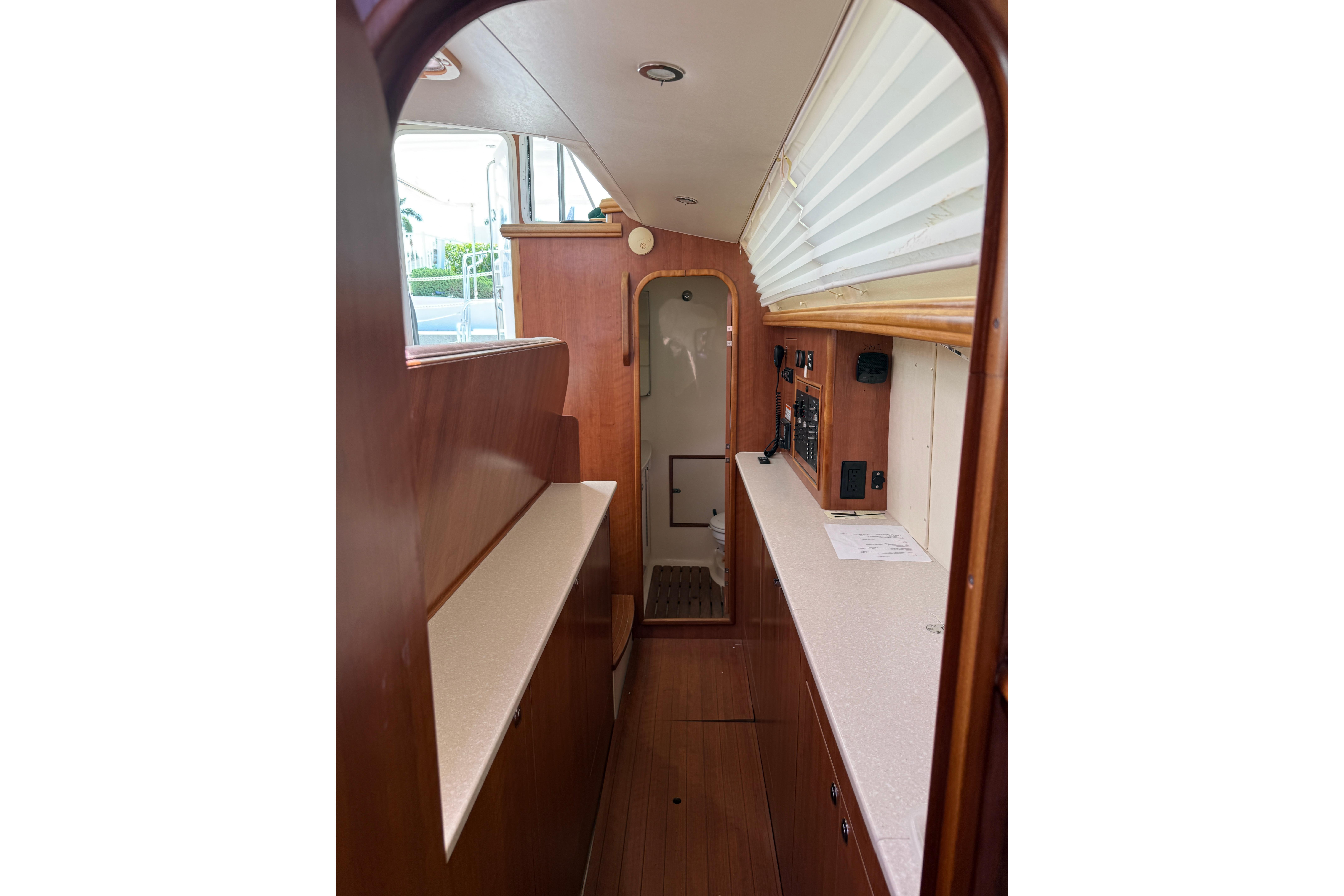 Interior of 2014 Gemini Legacy 35 sailboat with wood finish and modern amenities.