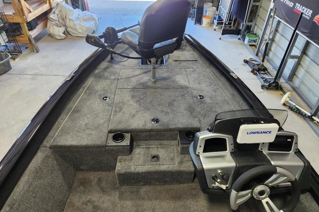2026 Tracker Pro Team 175 boat interior with steering wheel and Lowrance electronics.